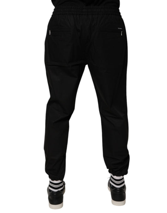 Pair of black pants with white stripes on sides