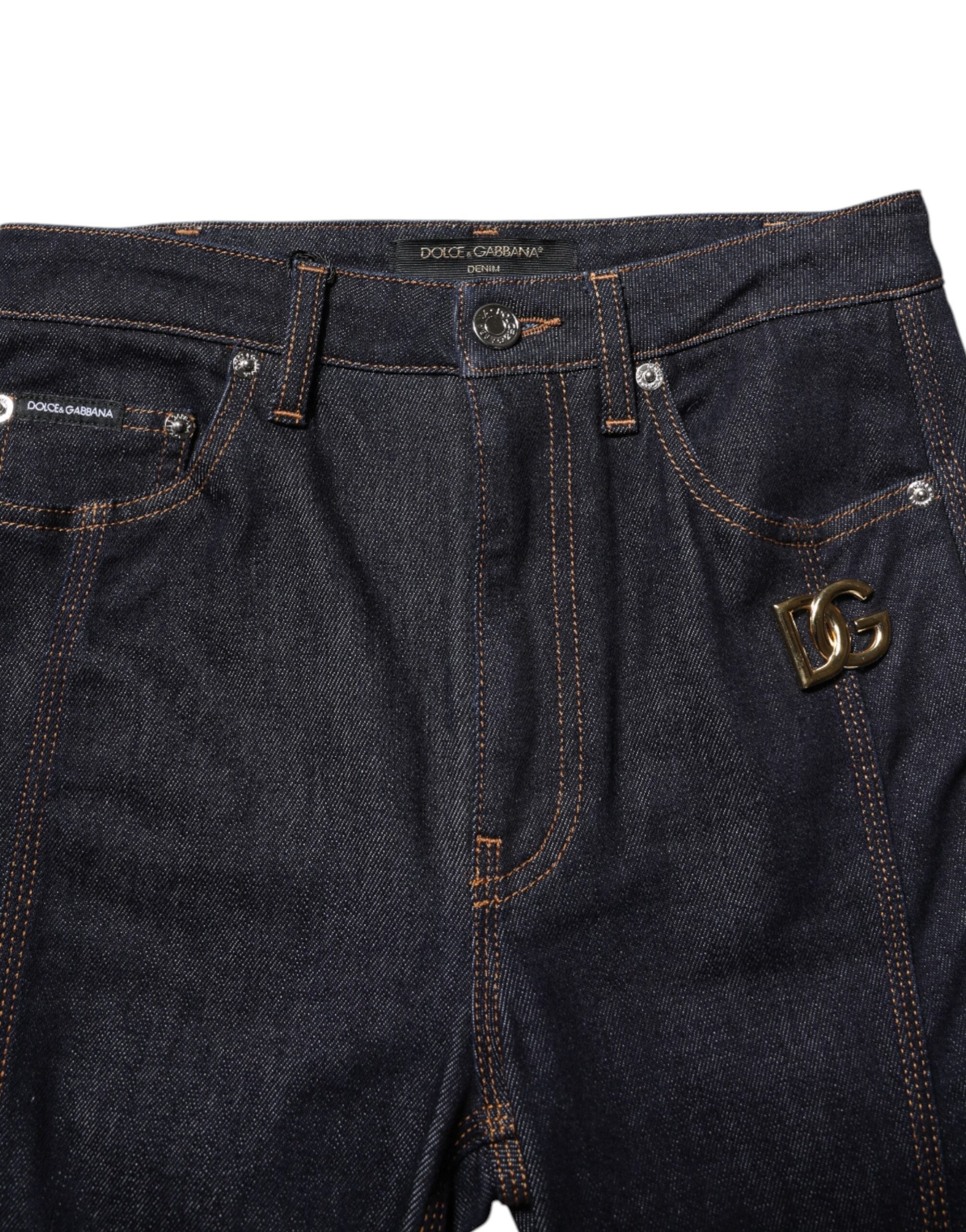 Pair of blue denim jeans with embroidered logo on right leg