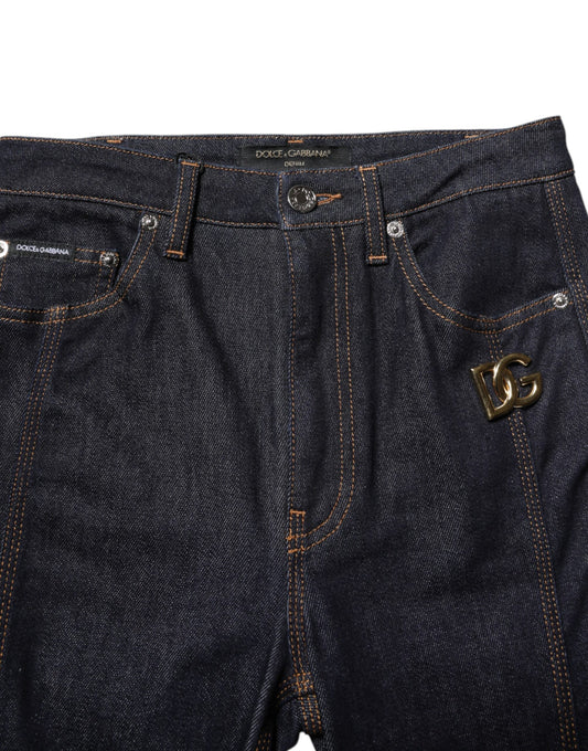Pair of blue denim jeans with embroidered logo on right leg