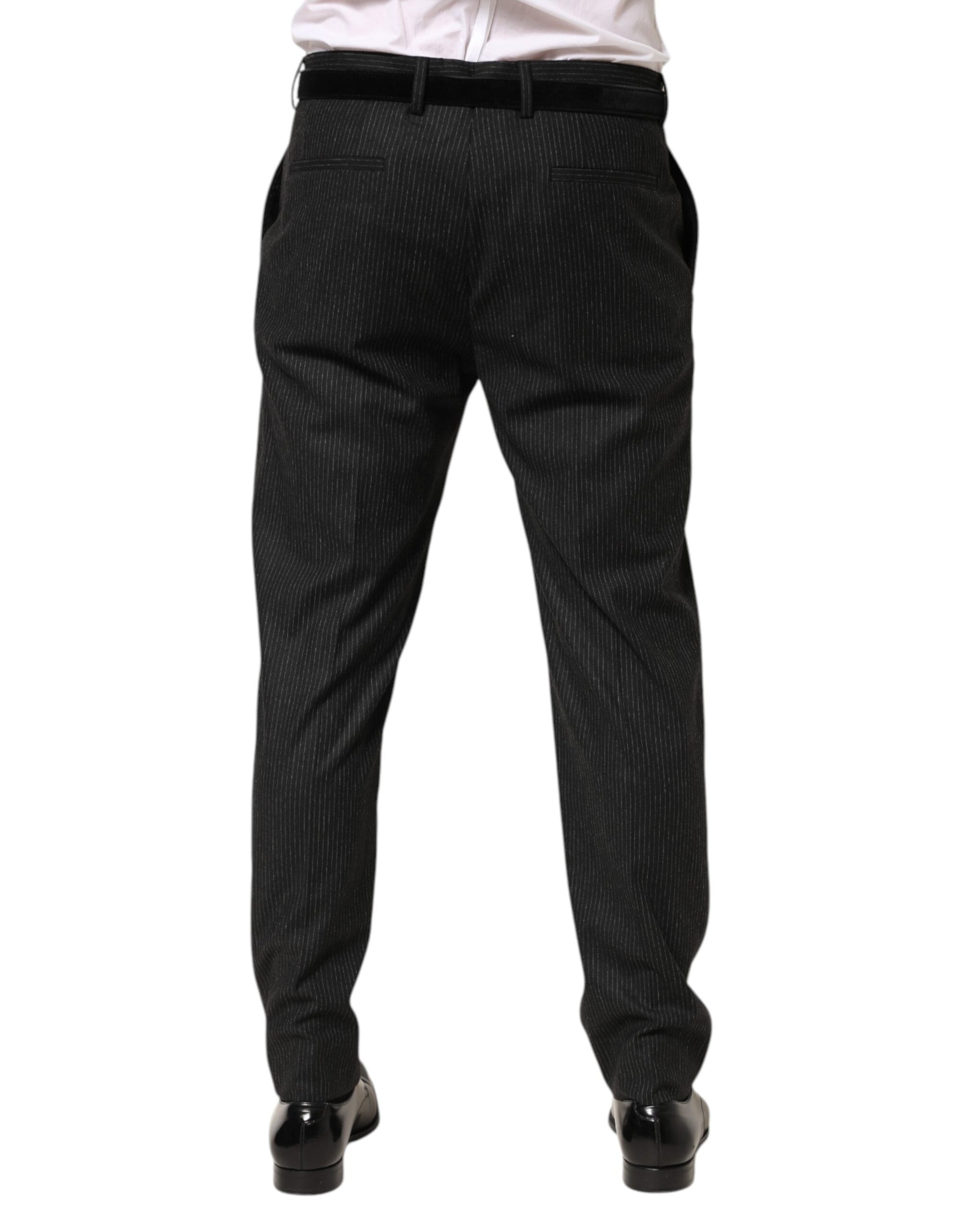 A pair of black mid-waist dress trousers with a subtle pattern