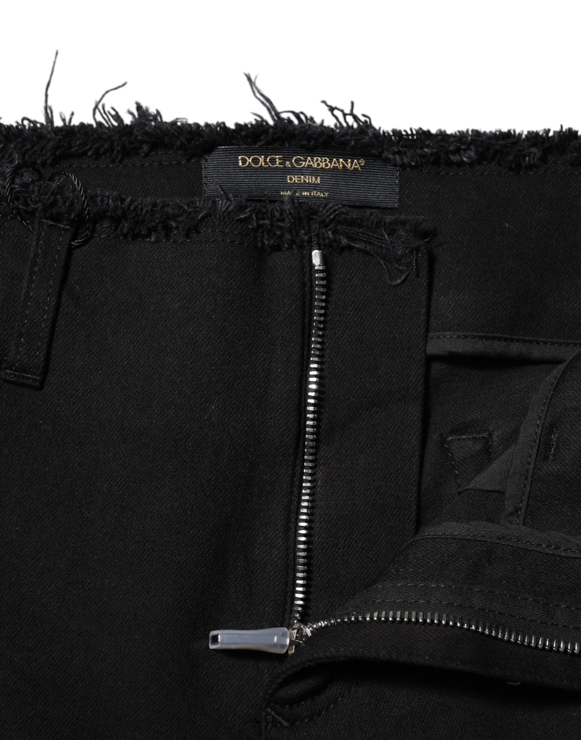 Black denim jeans with frayed hem and zippered side pocket
