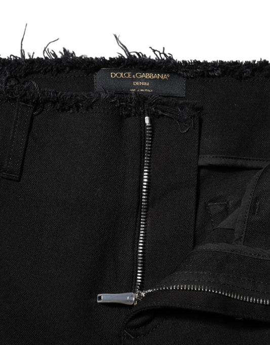 Black denim jeans with frayed hem and zippered side pocket