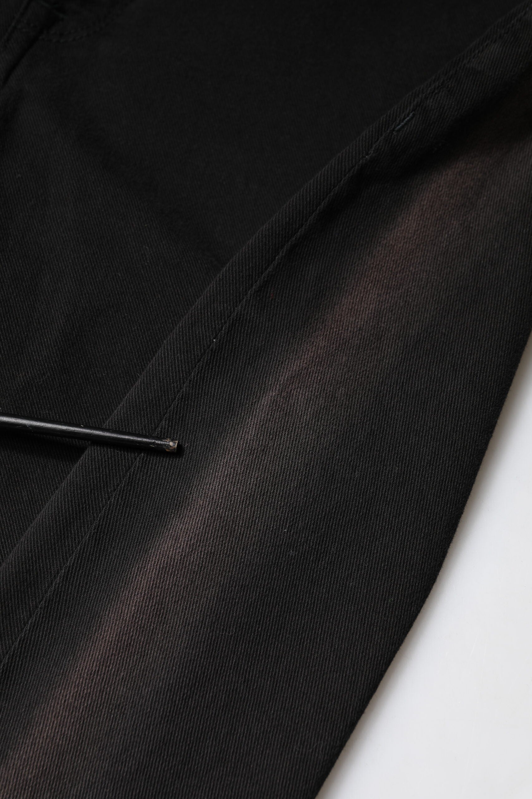 Black fabric with a zipper on the side