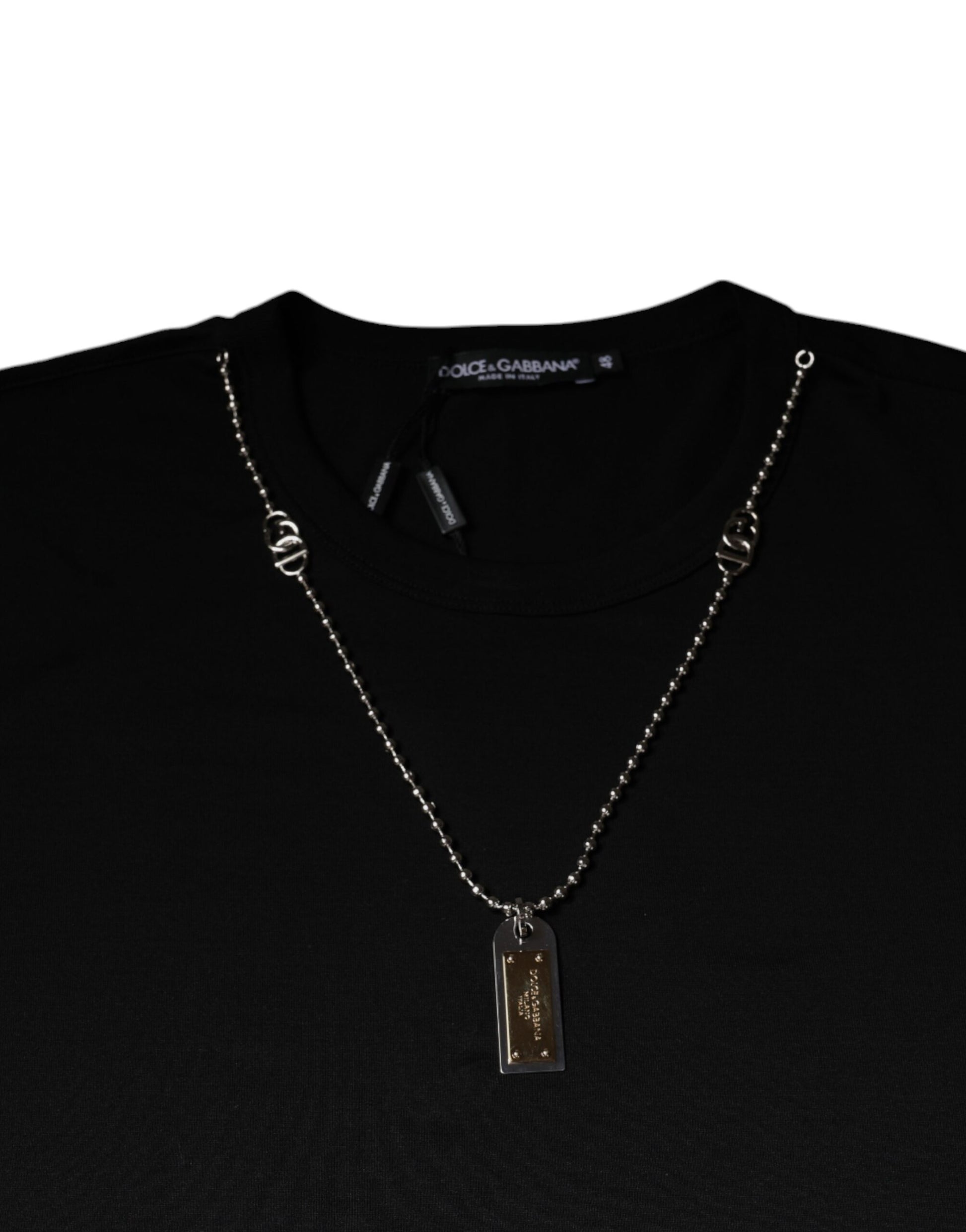 Black t-shirt with silver chain necklace featuring a tag pendant