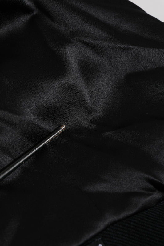 Black fabric with a small hole in it