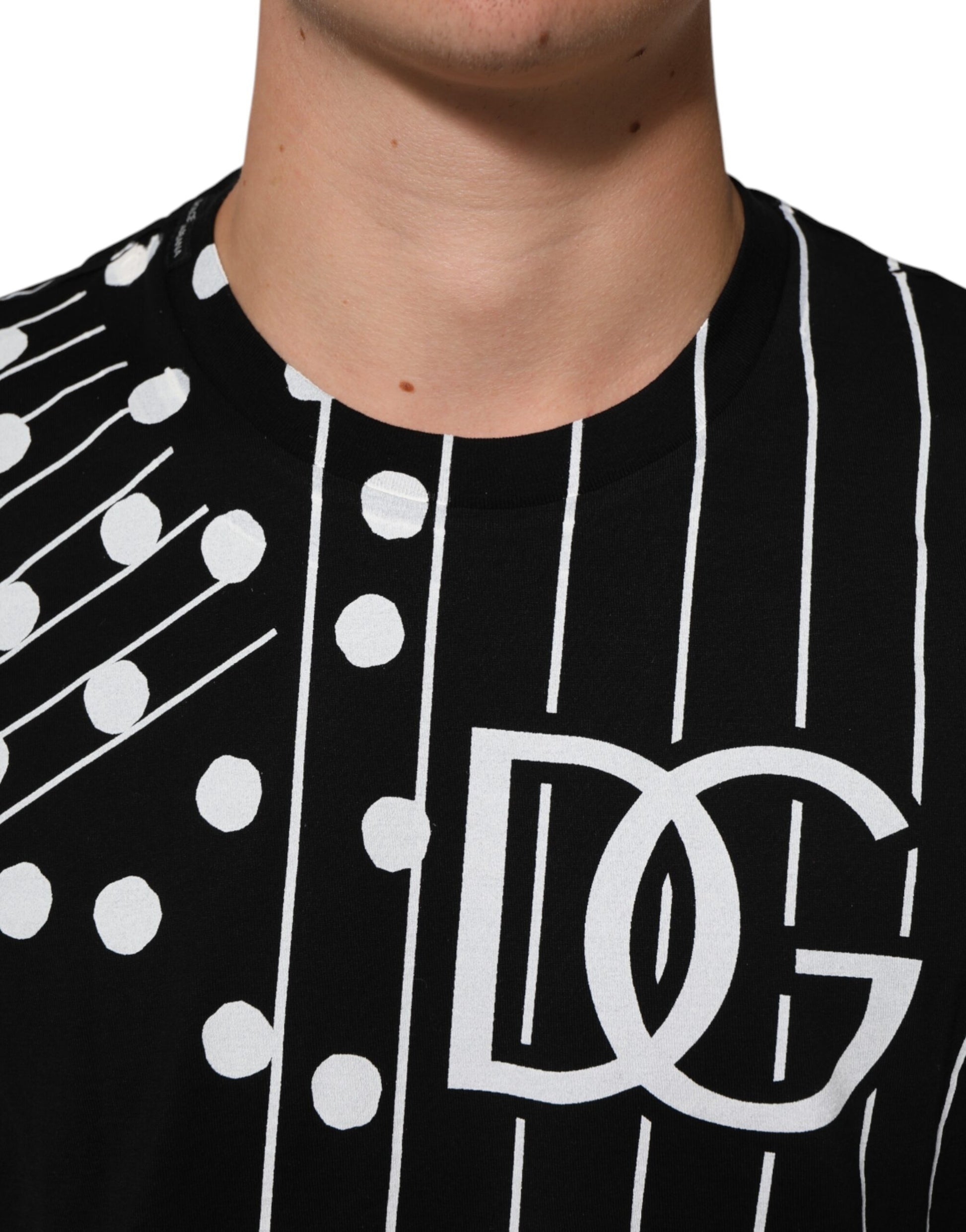 Black t-shirt with white polka dots and logo