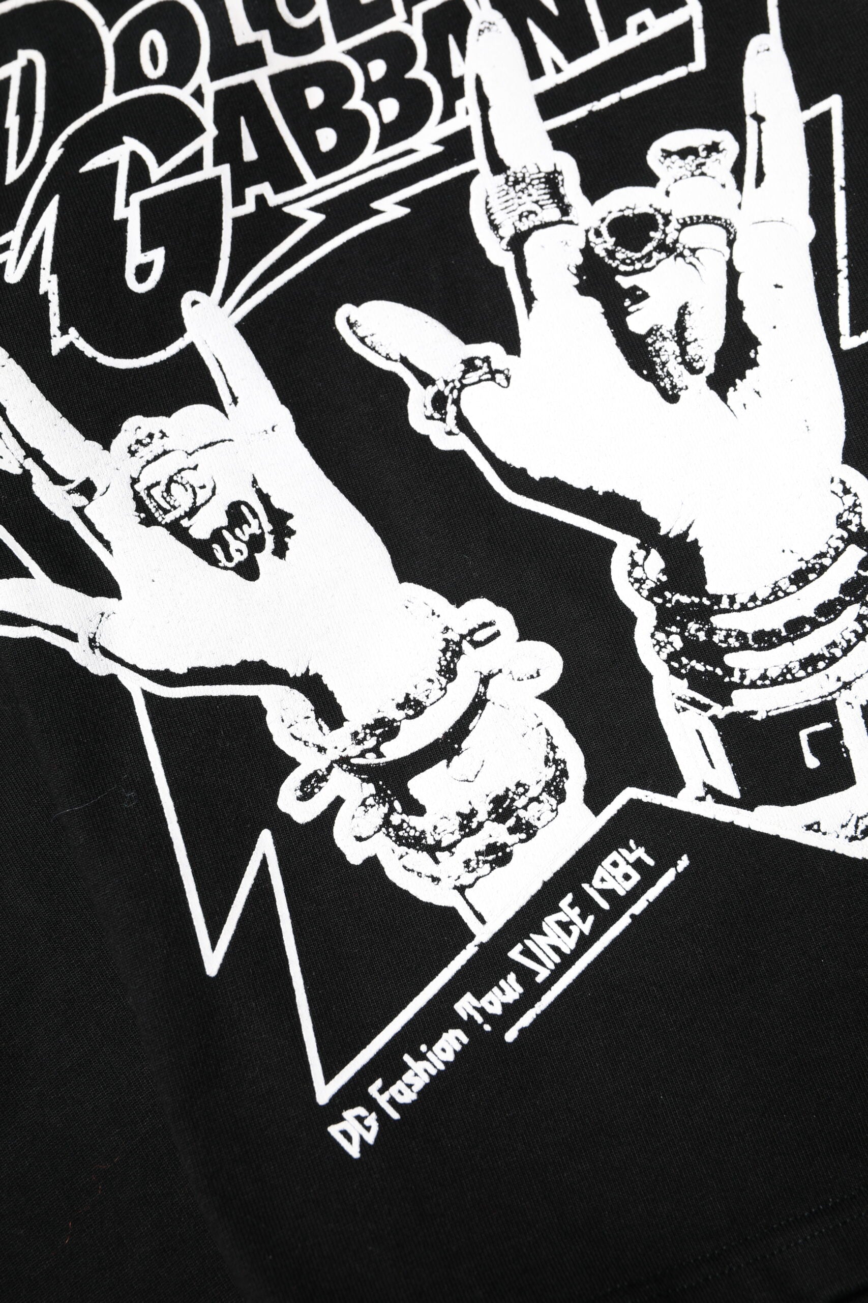 Black t-shirt with white graphic design featuring a hand making a peace sign