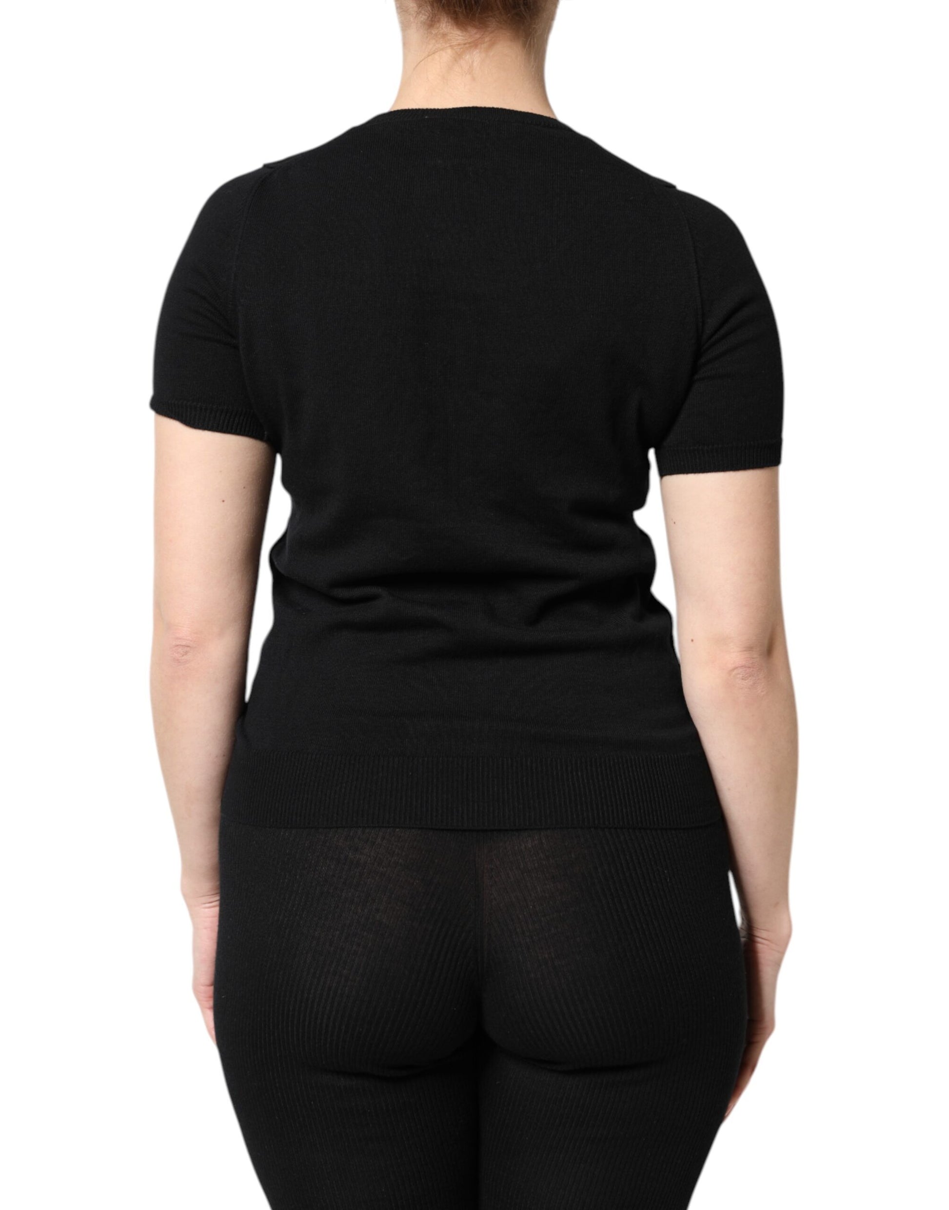 Black athletic leggings on a woman's back