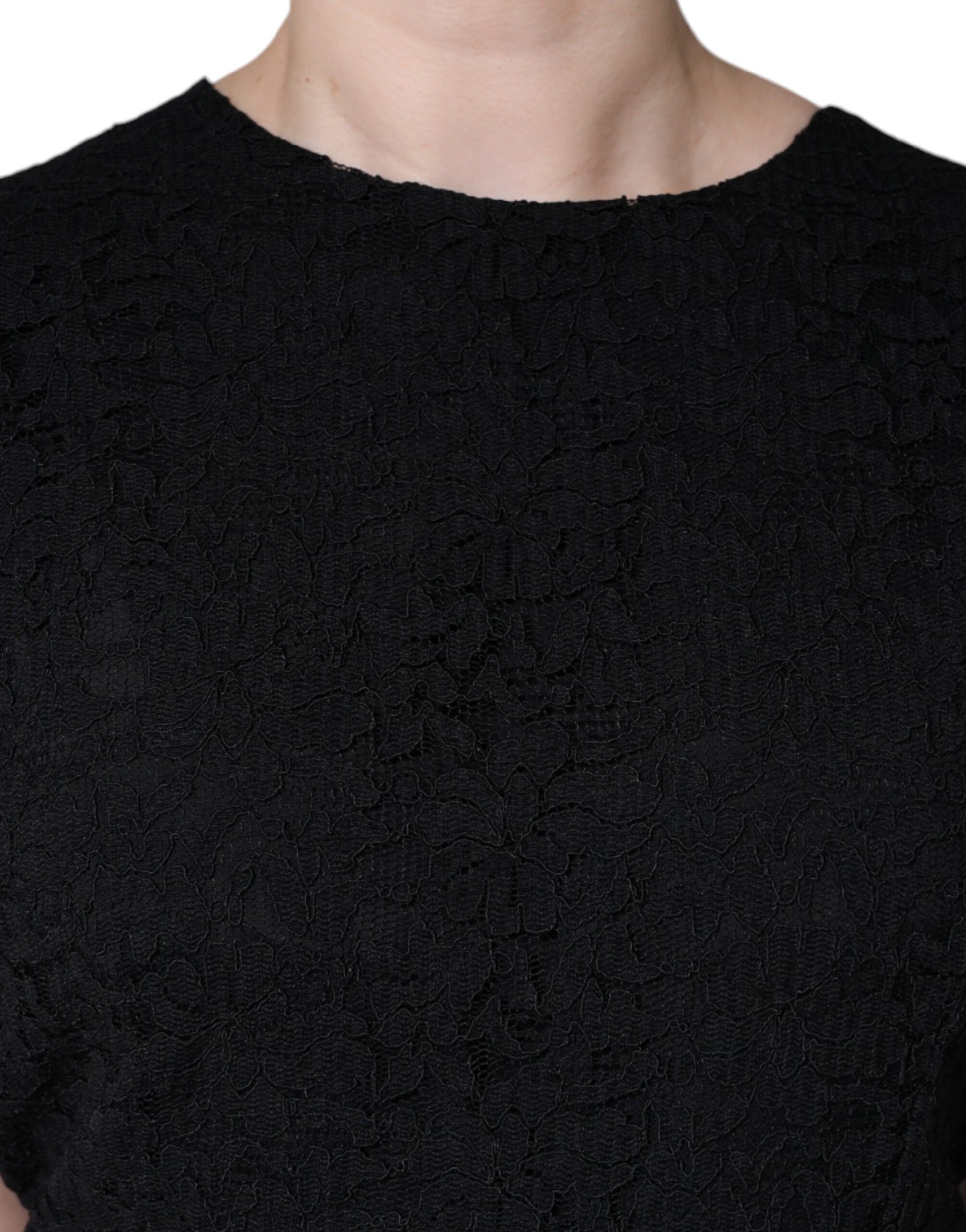 A black cotton sheath knee length dress with a textured pattern