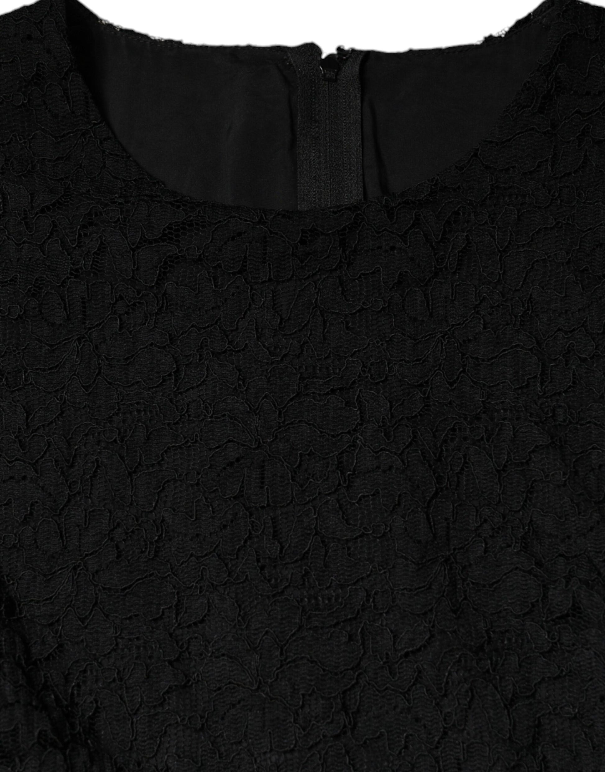 A black sheath dress with lace detailing on the bodice and sleeves