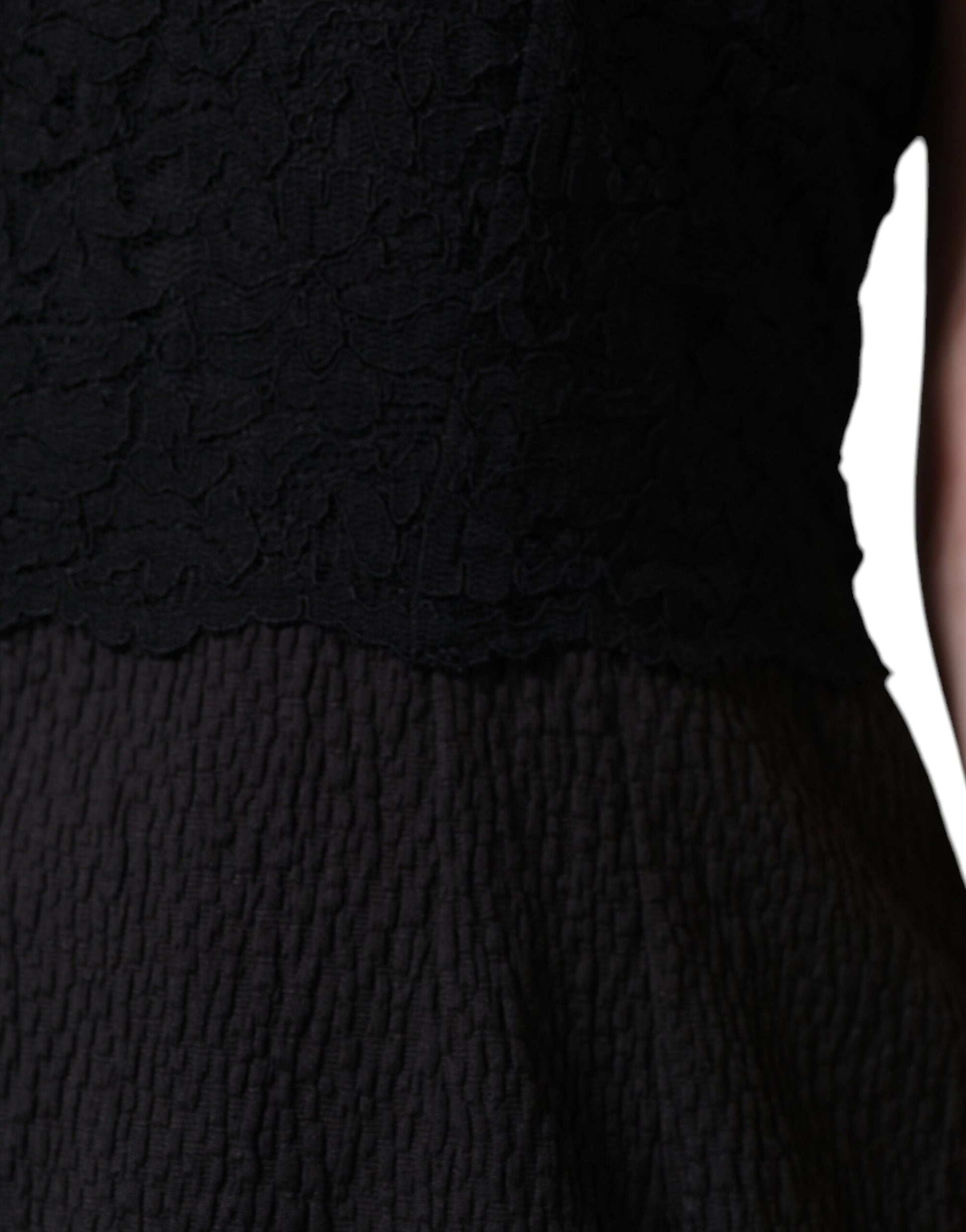 A black cotton sheath knee length dress with lace detailing