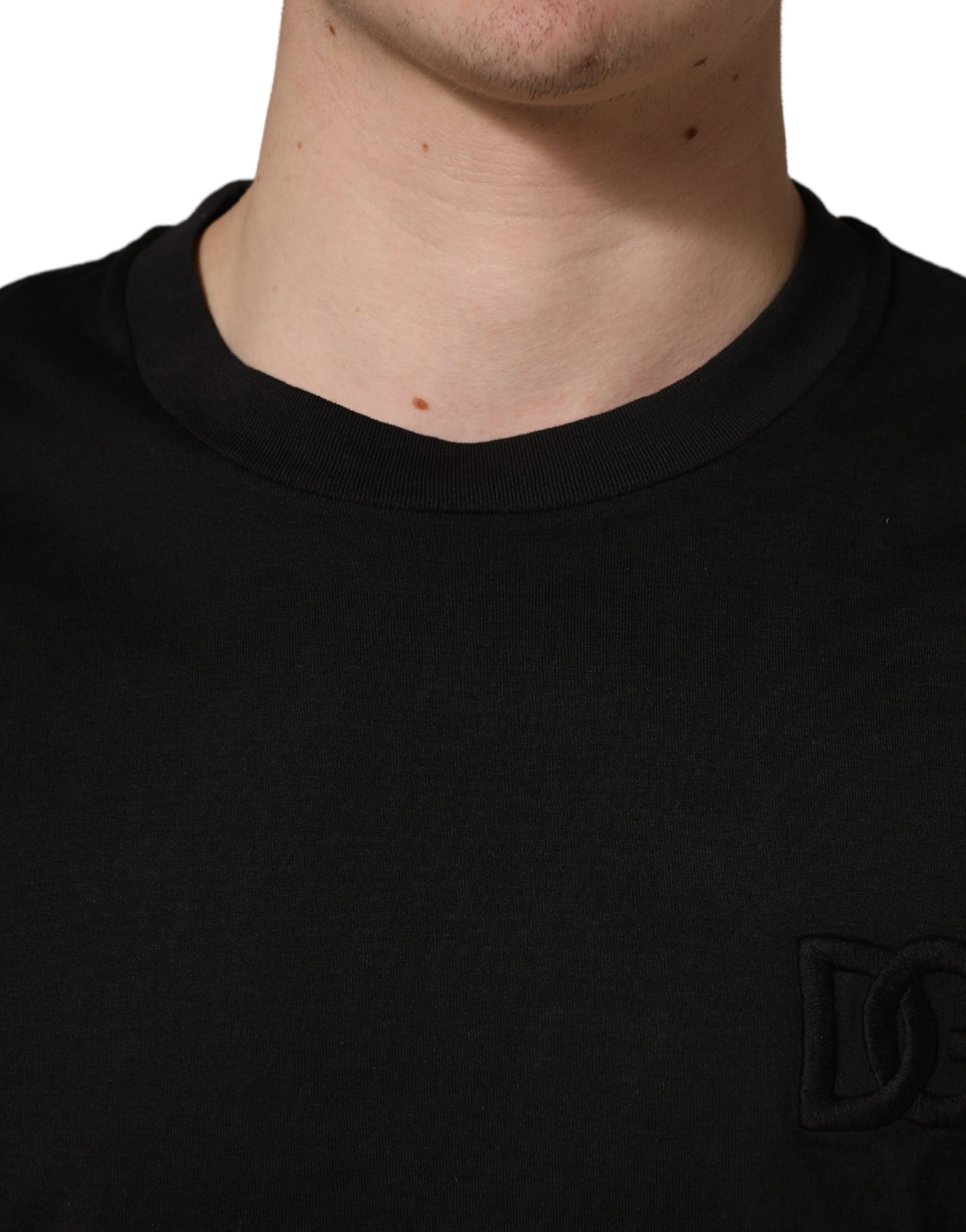 Black short sleeve shirt on a man