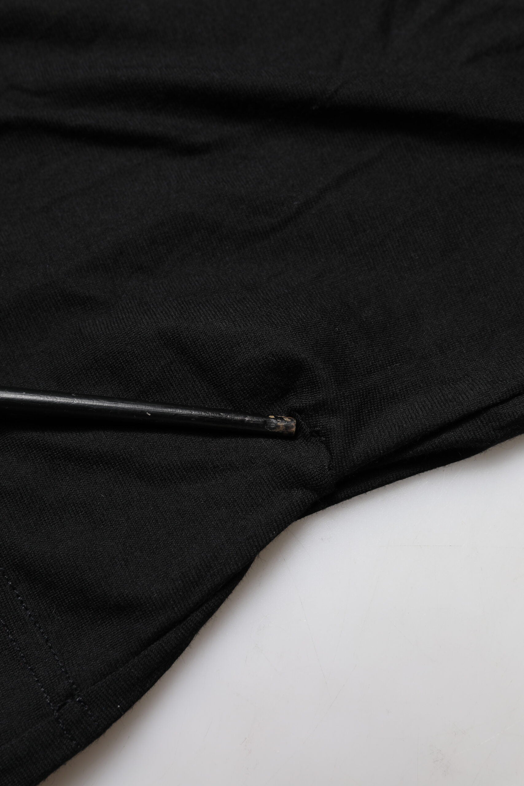 Black fabric with a hole in the corner