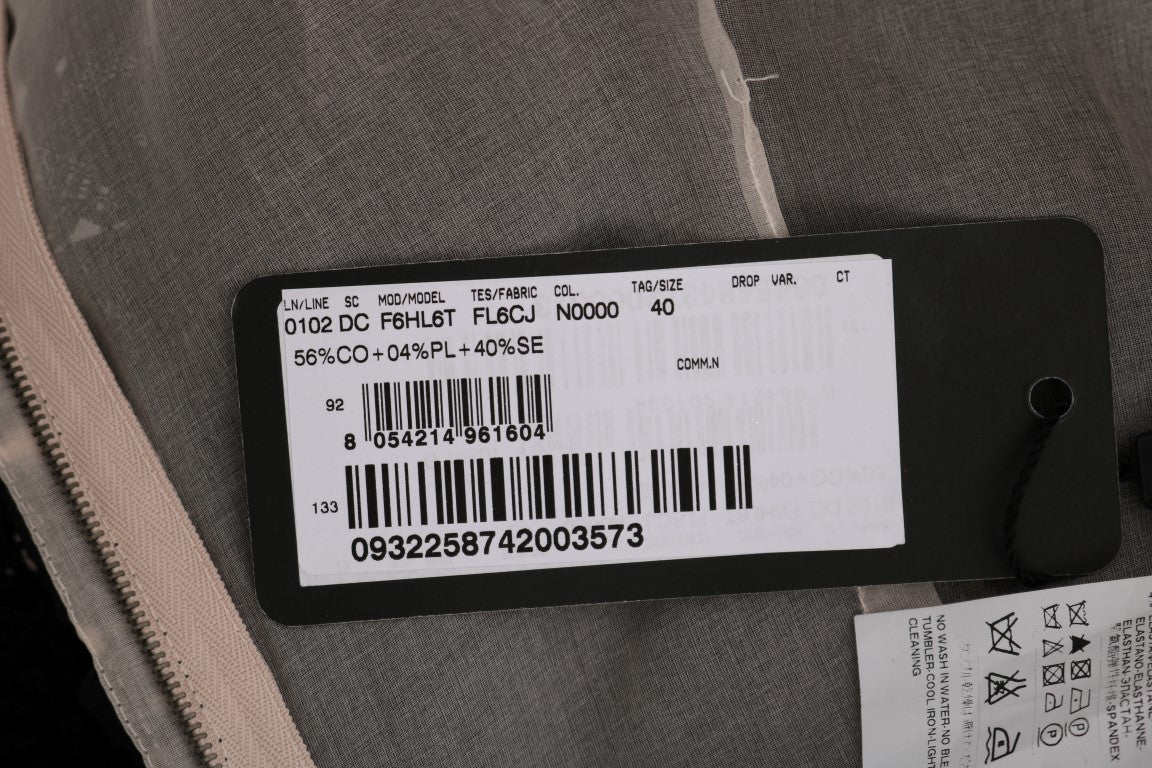 Black tag on clothing with white barcode and text