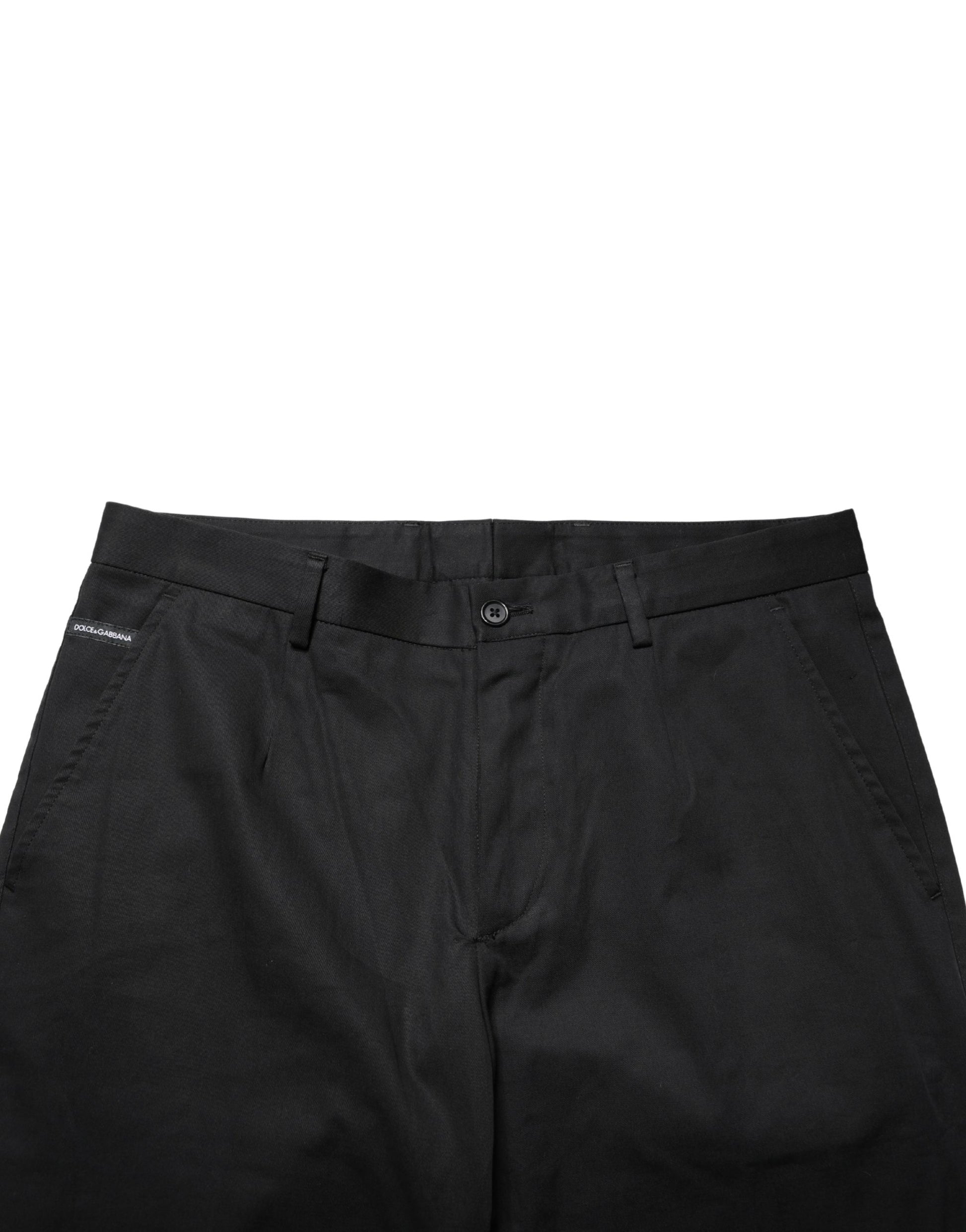 A pair of black cotton skinny dress pants from the brand Dolce & Gabbana. They feature a textured pattern and