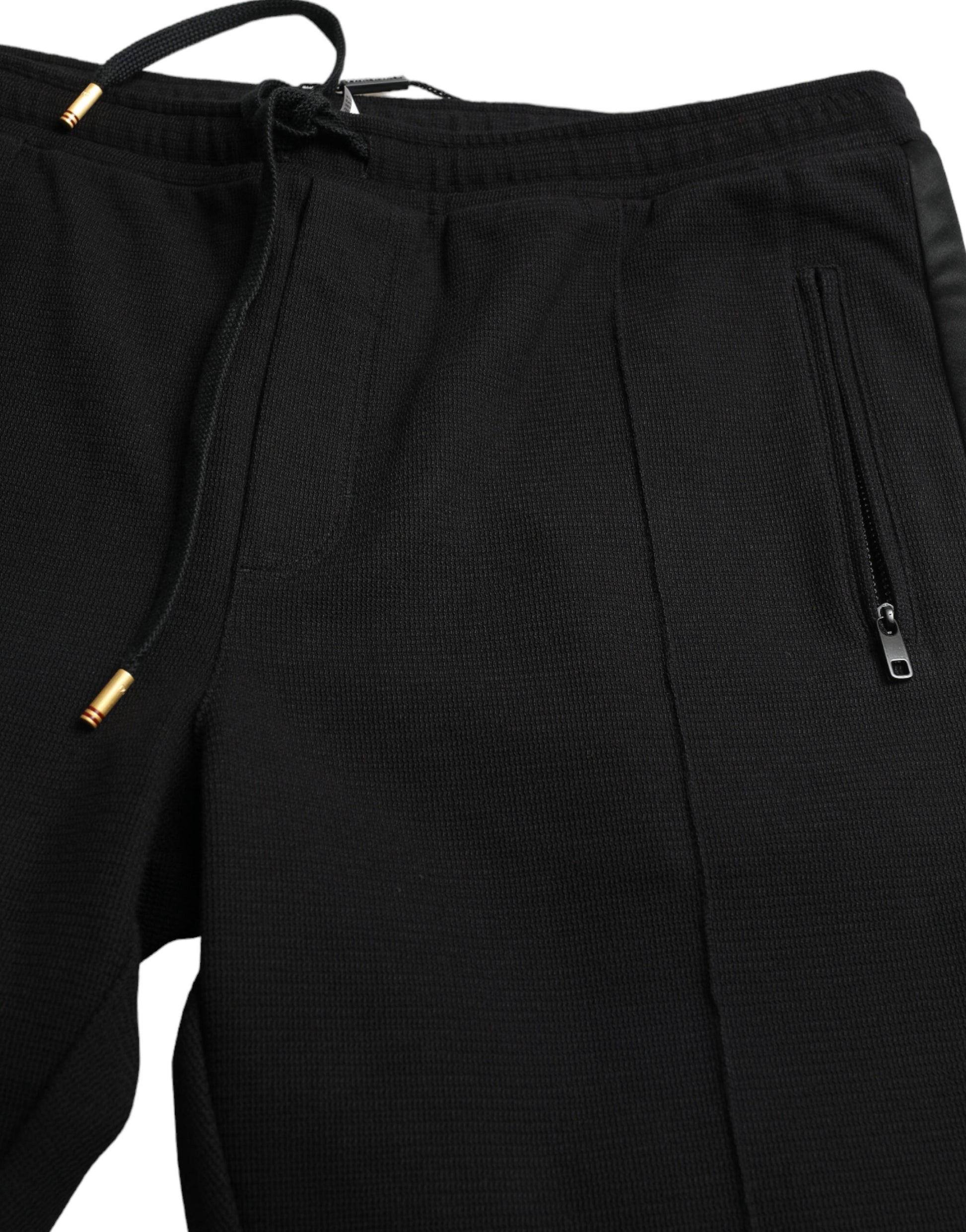 Black athletic pants with zippered pockets