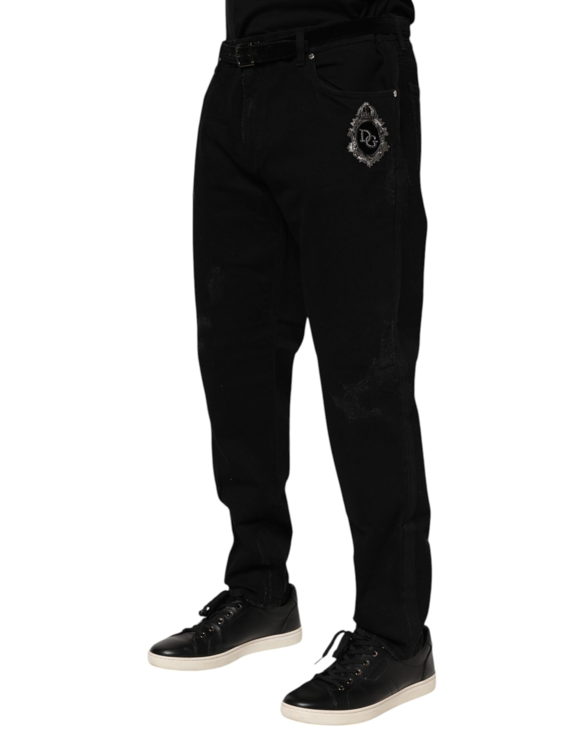 Black pants with a logo on the left leg