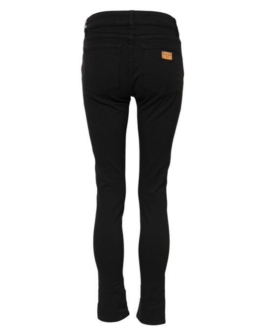 Black skinny jeans with a yellow tag on waistband