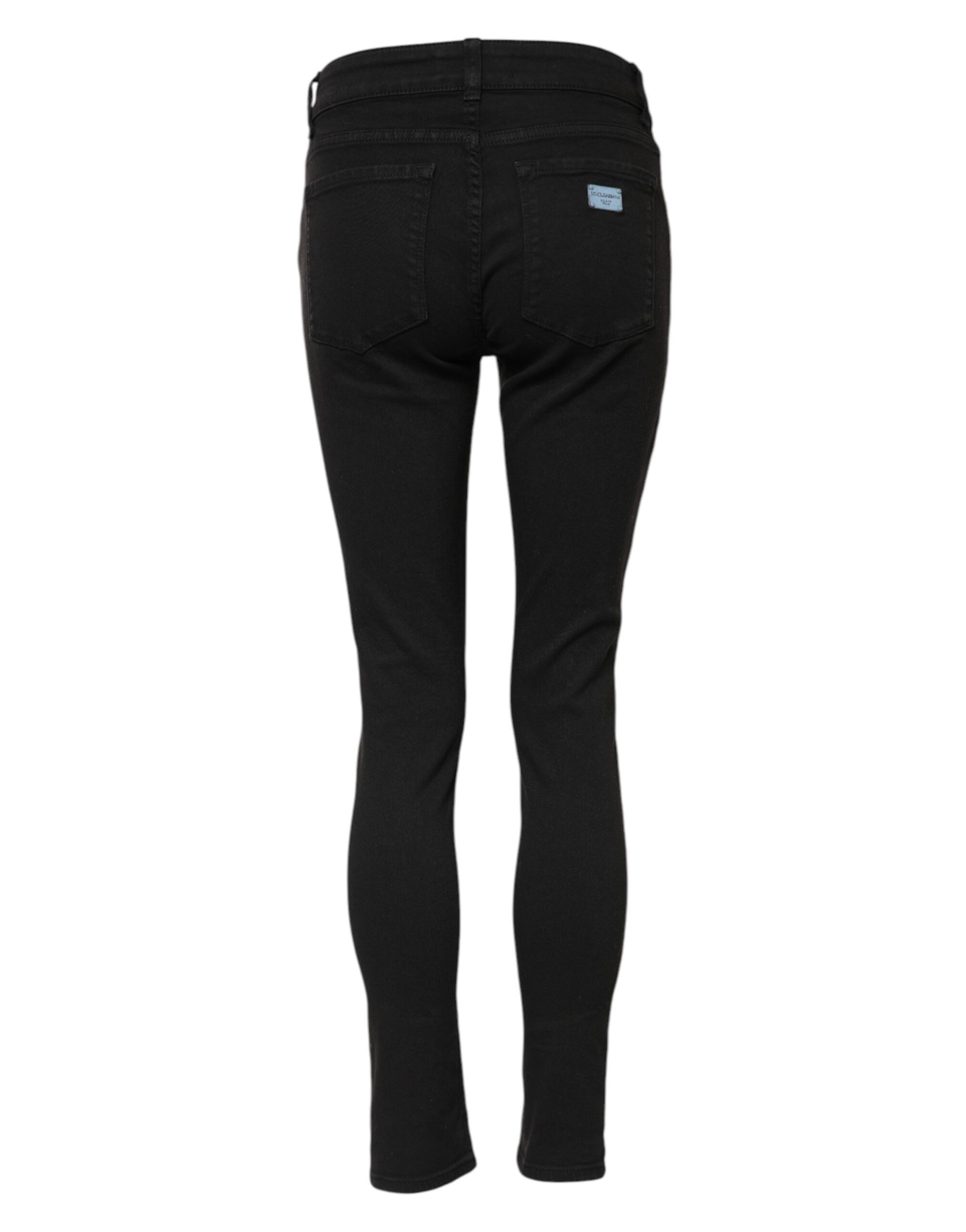 Pair of black jeans with a visible logo on the back right leg