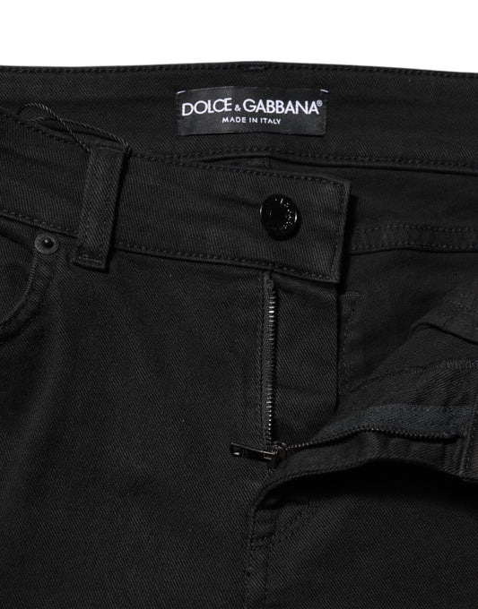 Pair of black jeans on a hanger