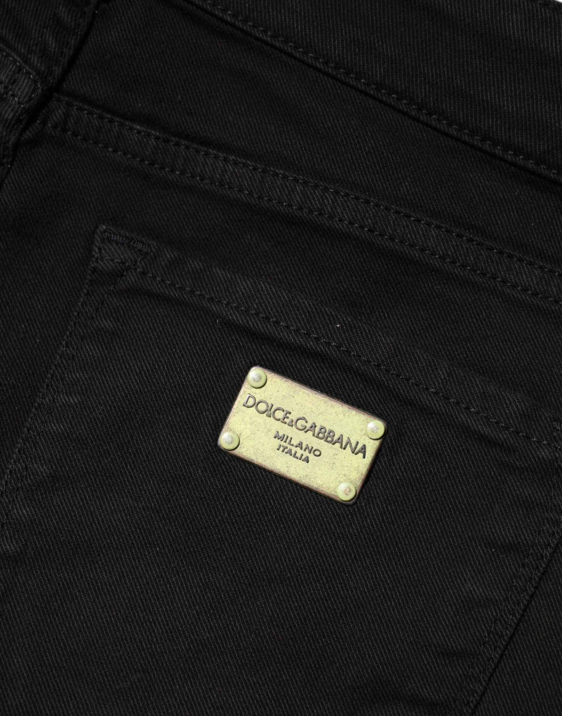 Black jeans with gold label on back pocket