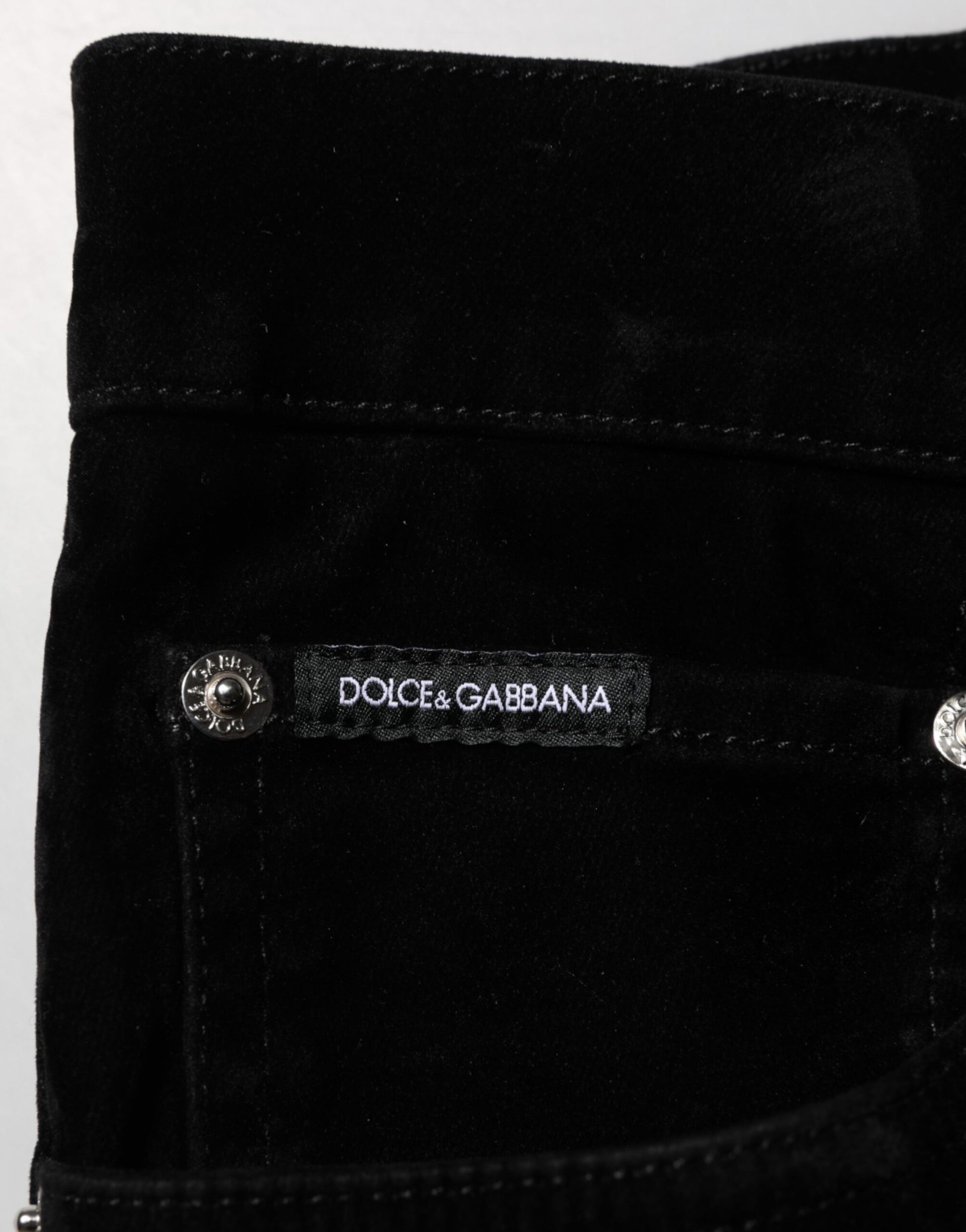 Black velvet pouch with silver zipper and brand label