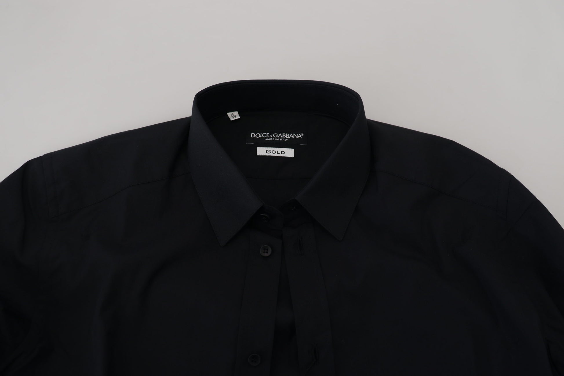 A black cotton slim fit formal dress shirt with a gold label