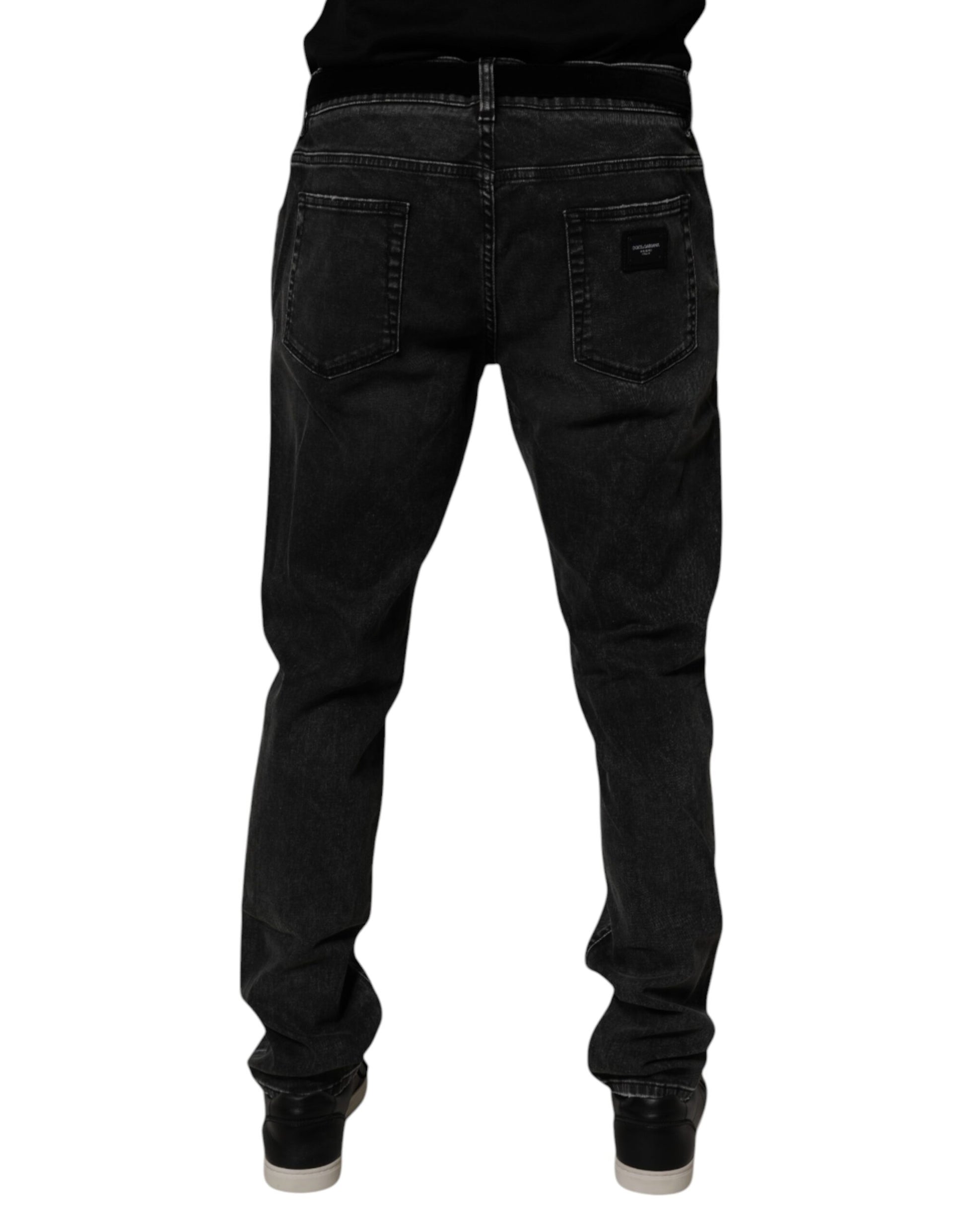 Pair of dark blue jeans with pockets on front