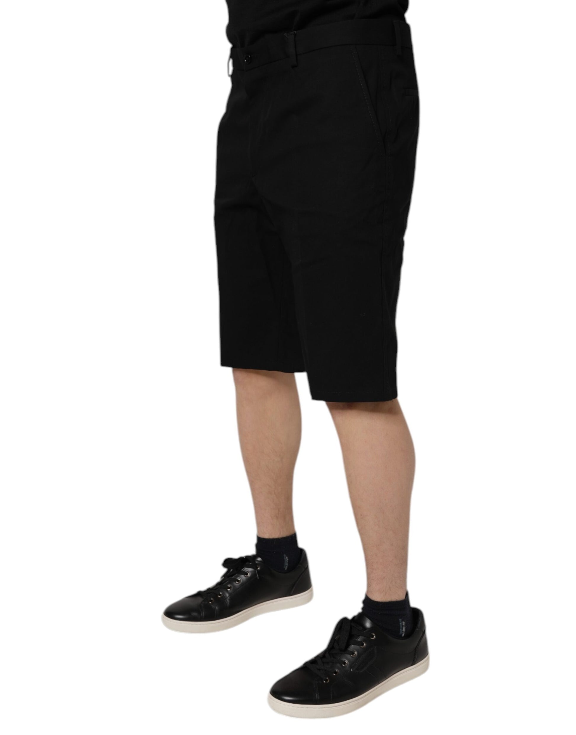 A pair of black cotton stretch mid waist bermuda shorts