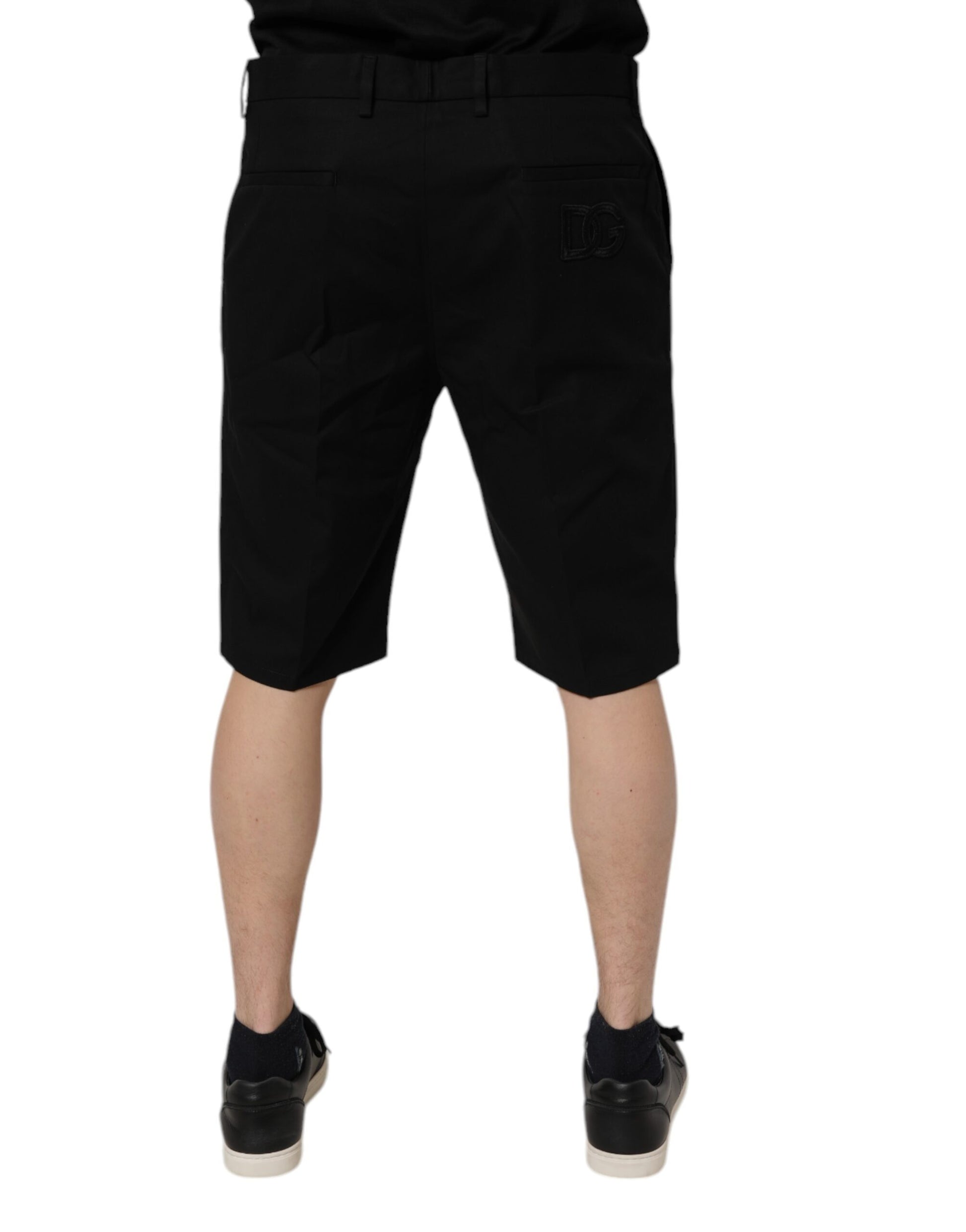 A pair of black cotton stretch mid waist bermuda shorts by Dolce & Gabbana