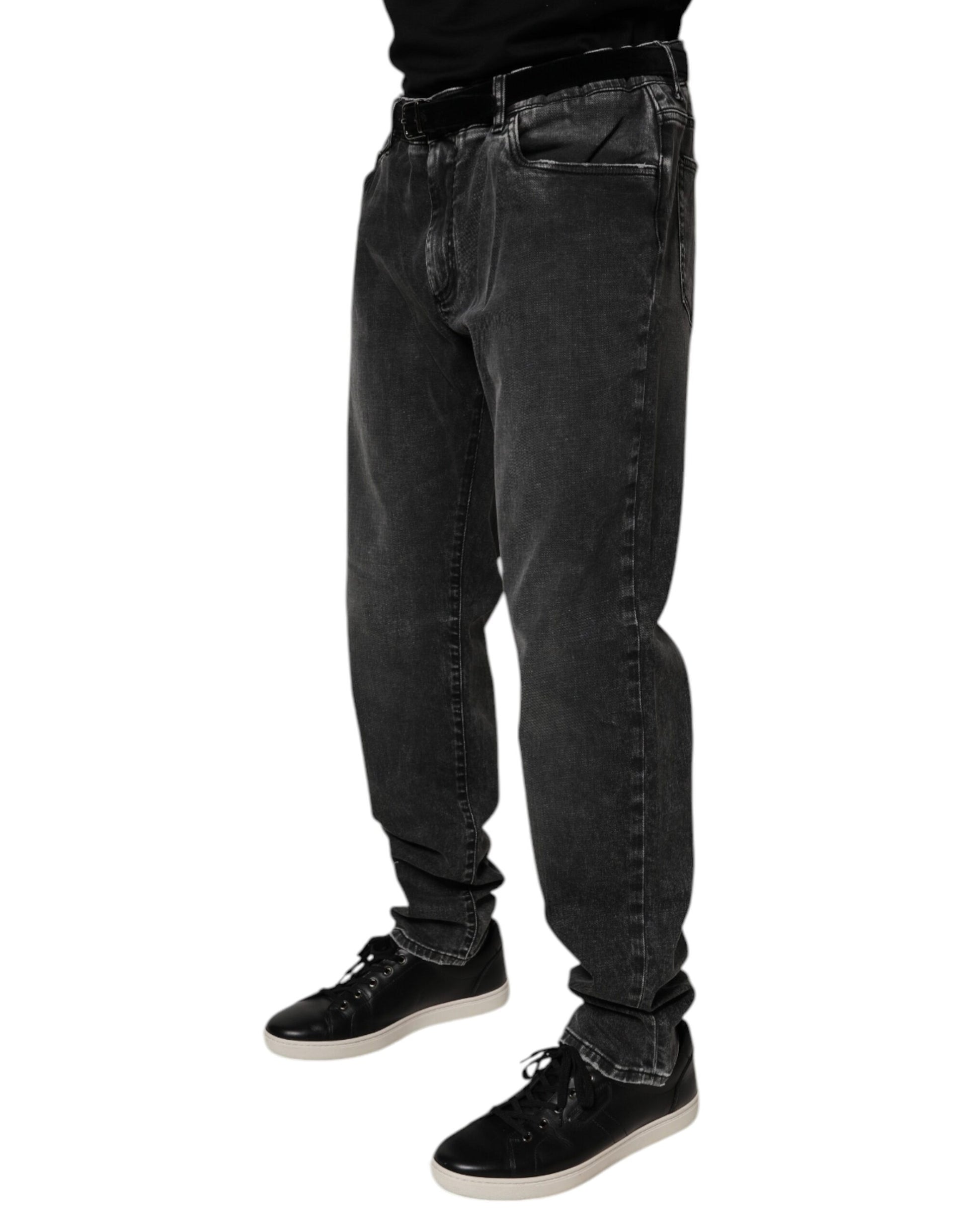 Man wearing jeans and black shoes