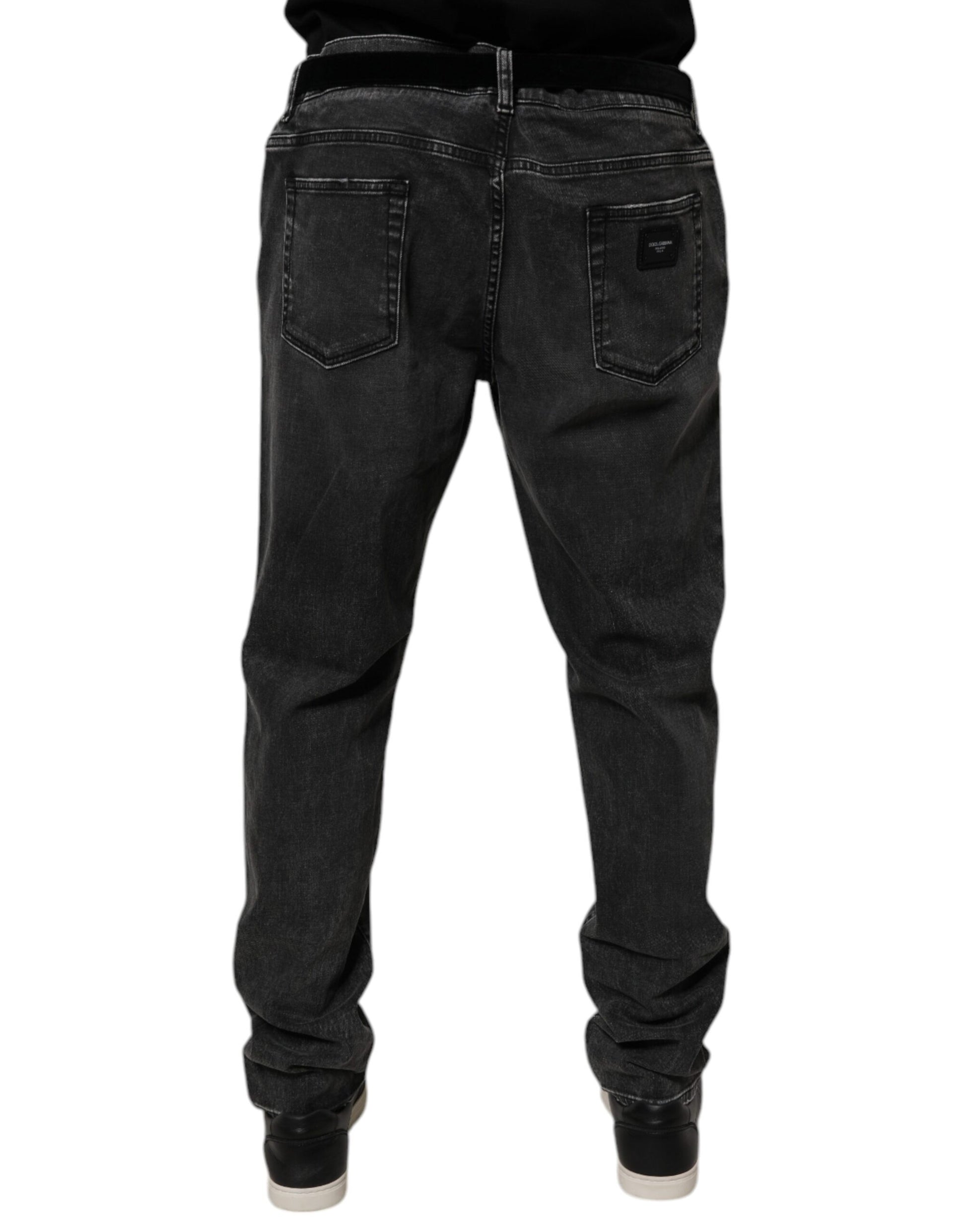 Pair of dark blue jeans with pockets on front