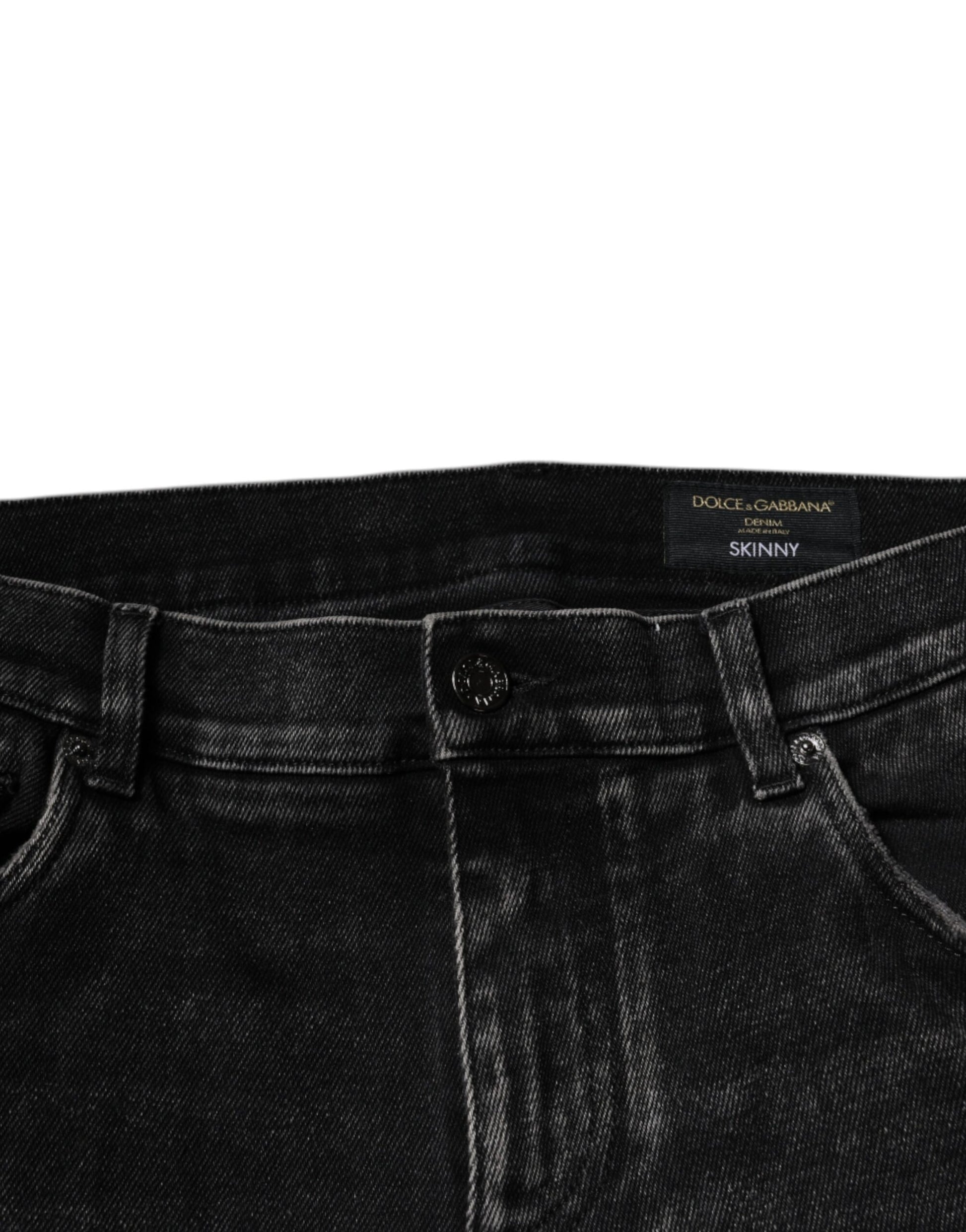 Pair of dark blue denim jeans with visible stitching details
