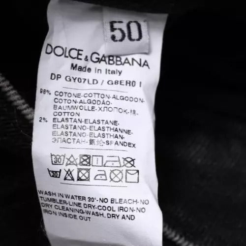 Tag on clothing item indicating brand, material, care instructions, and country of origin