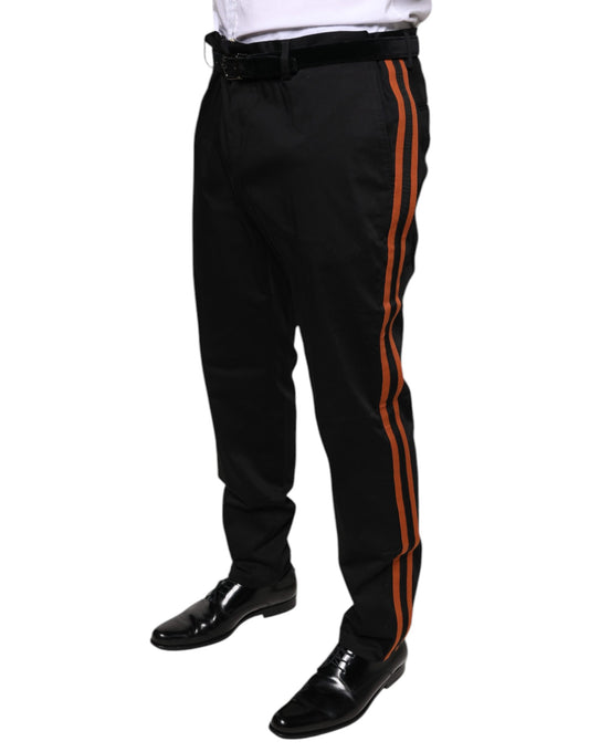 A pair of black cotton stretch skinny men's dress pants with red stripe down the sides