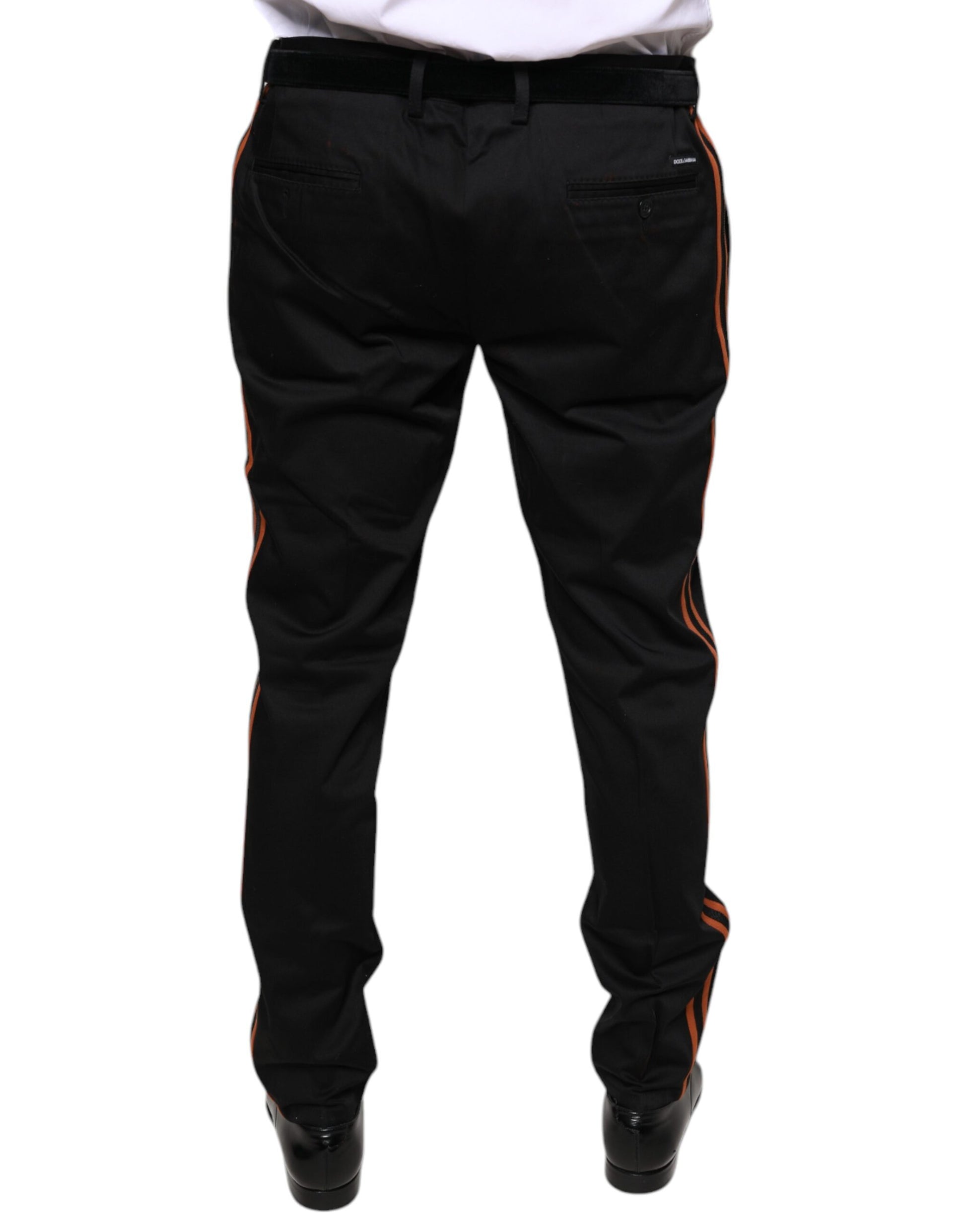 A pair of black cotton stretch skinny men's dress pants with red stripe detailing