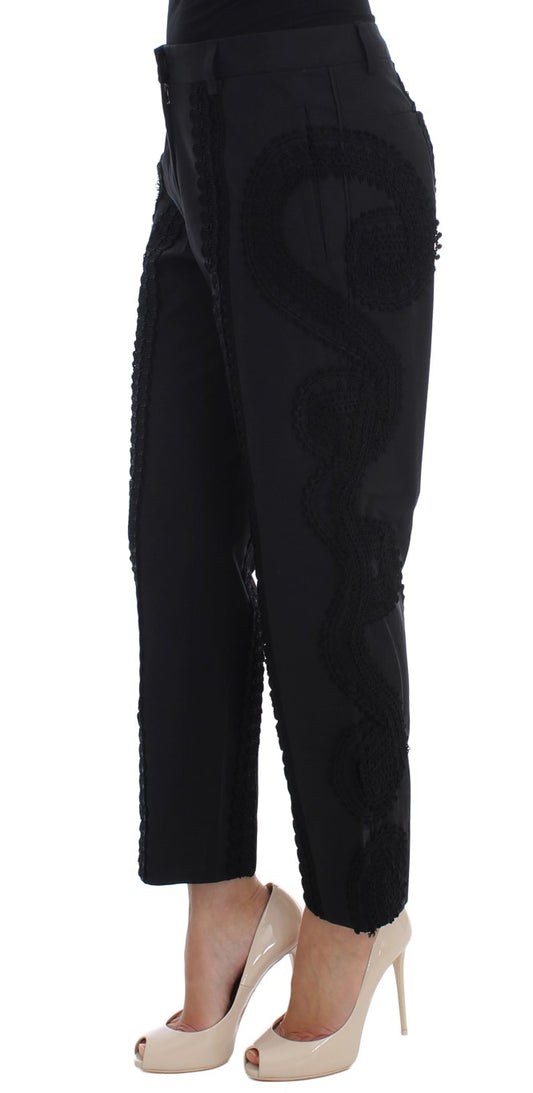 Pair of black pants with a high waist and faux pockets