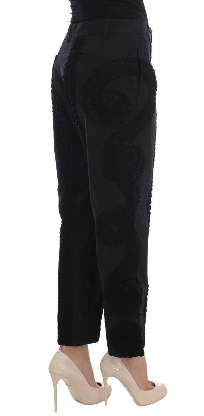 Woman wearing black pants and heels