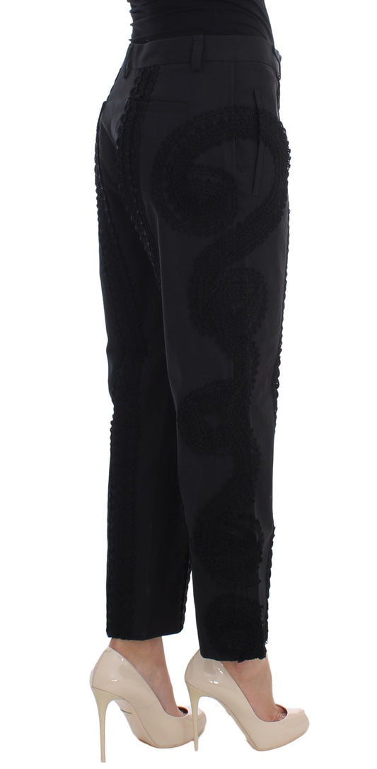 Woman wearing black pants and heels