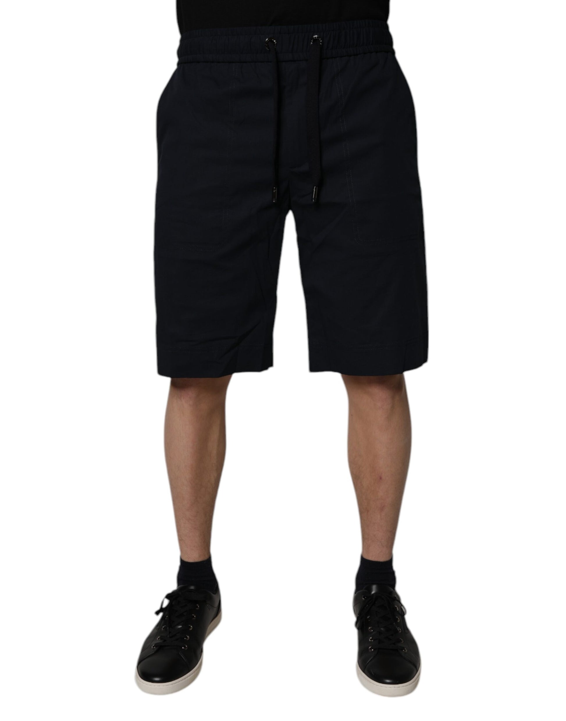 Man wearing black shorts and shoes