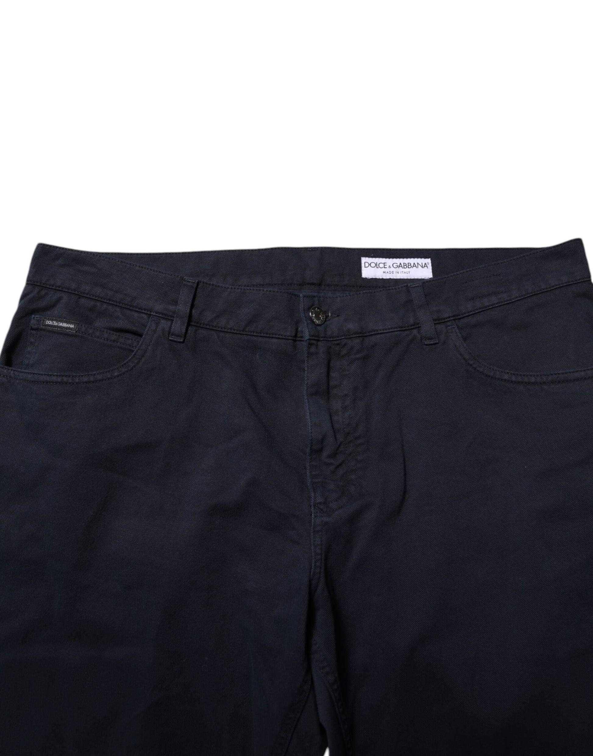 Dark blue denim jeans with visible stitching and a tag on the waistband