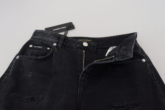 Pair of black denim jeans with zippered pockets