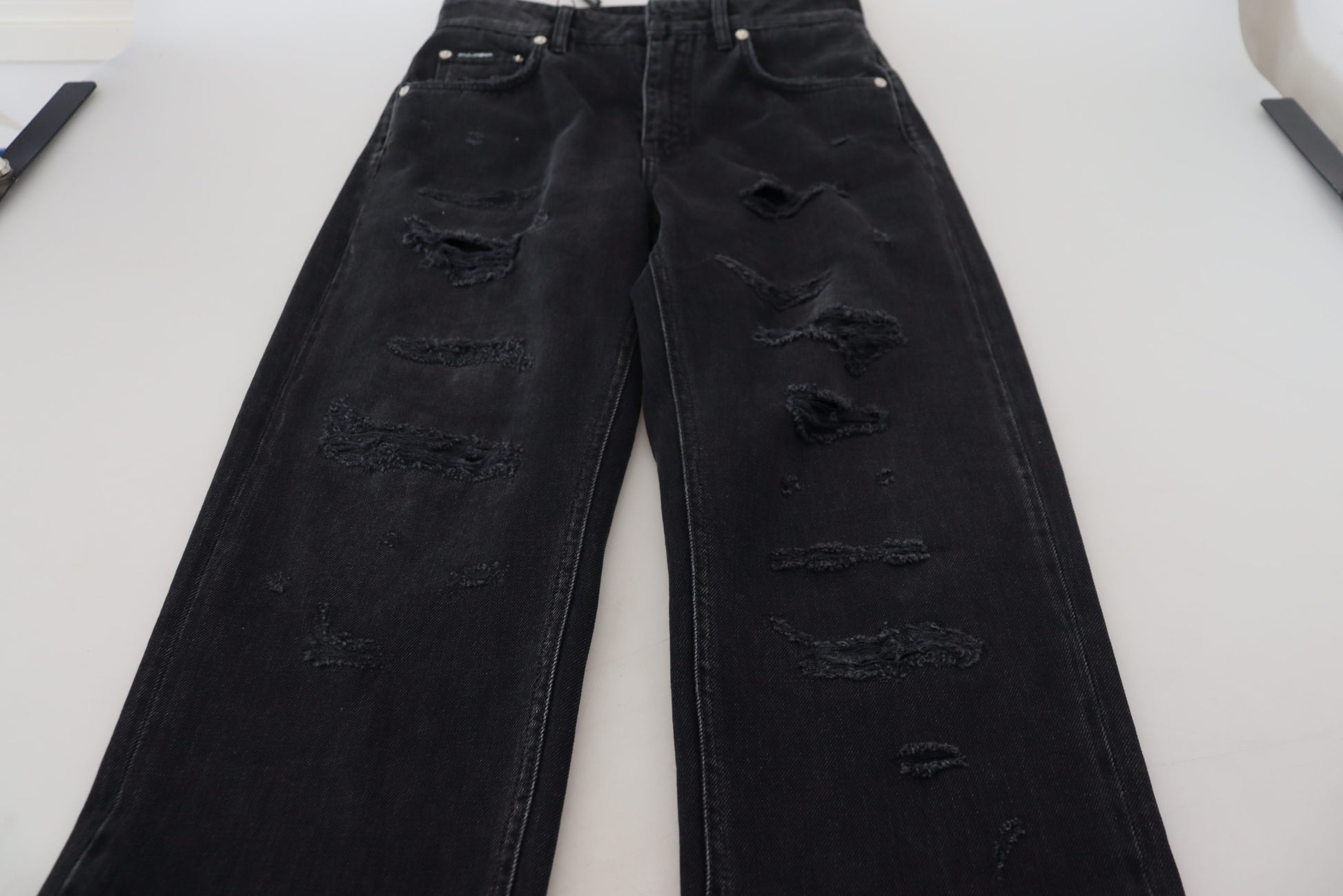 Pair of distressed jeans on a table