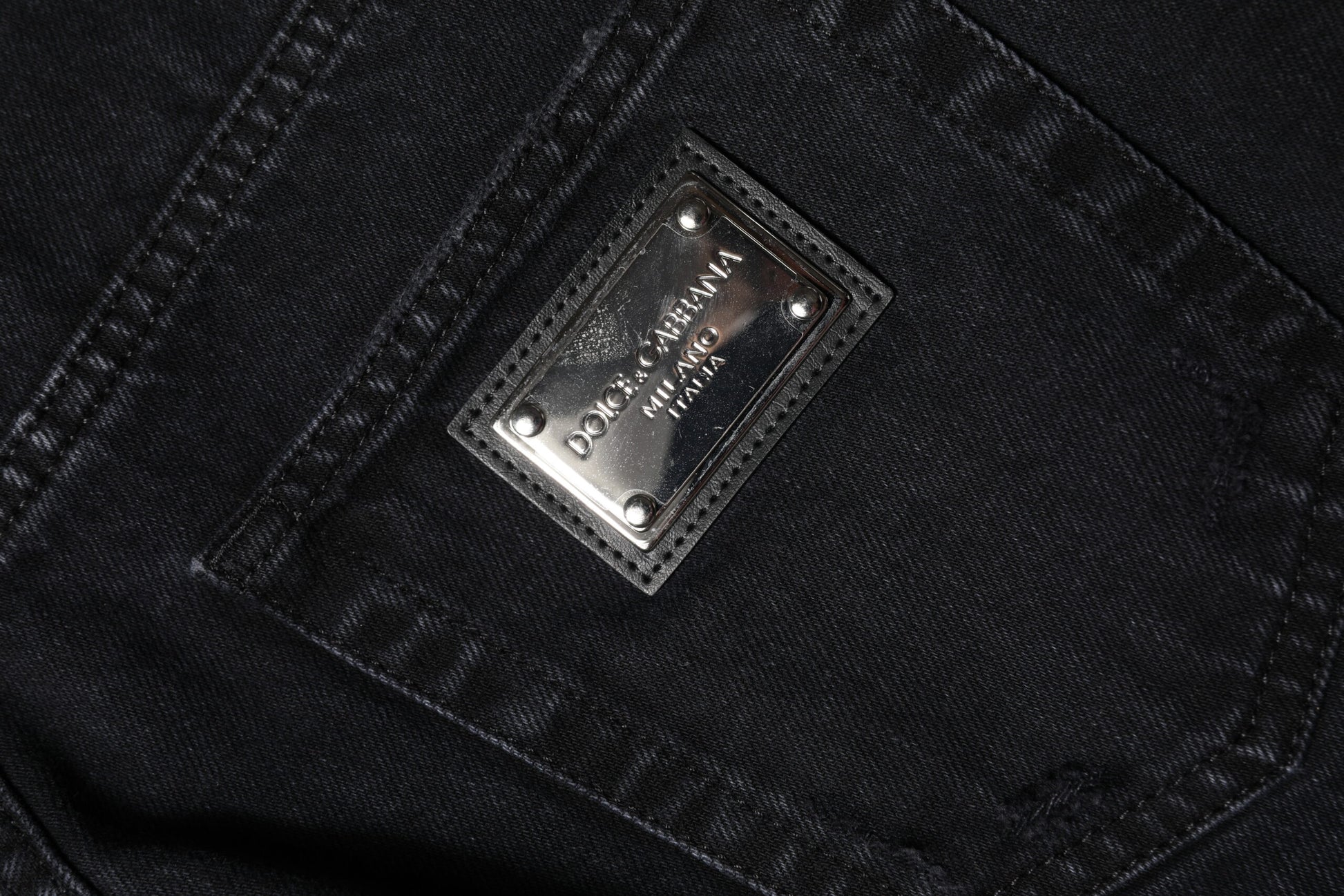 Silver label on jeans pocket