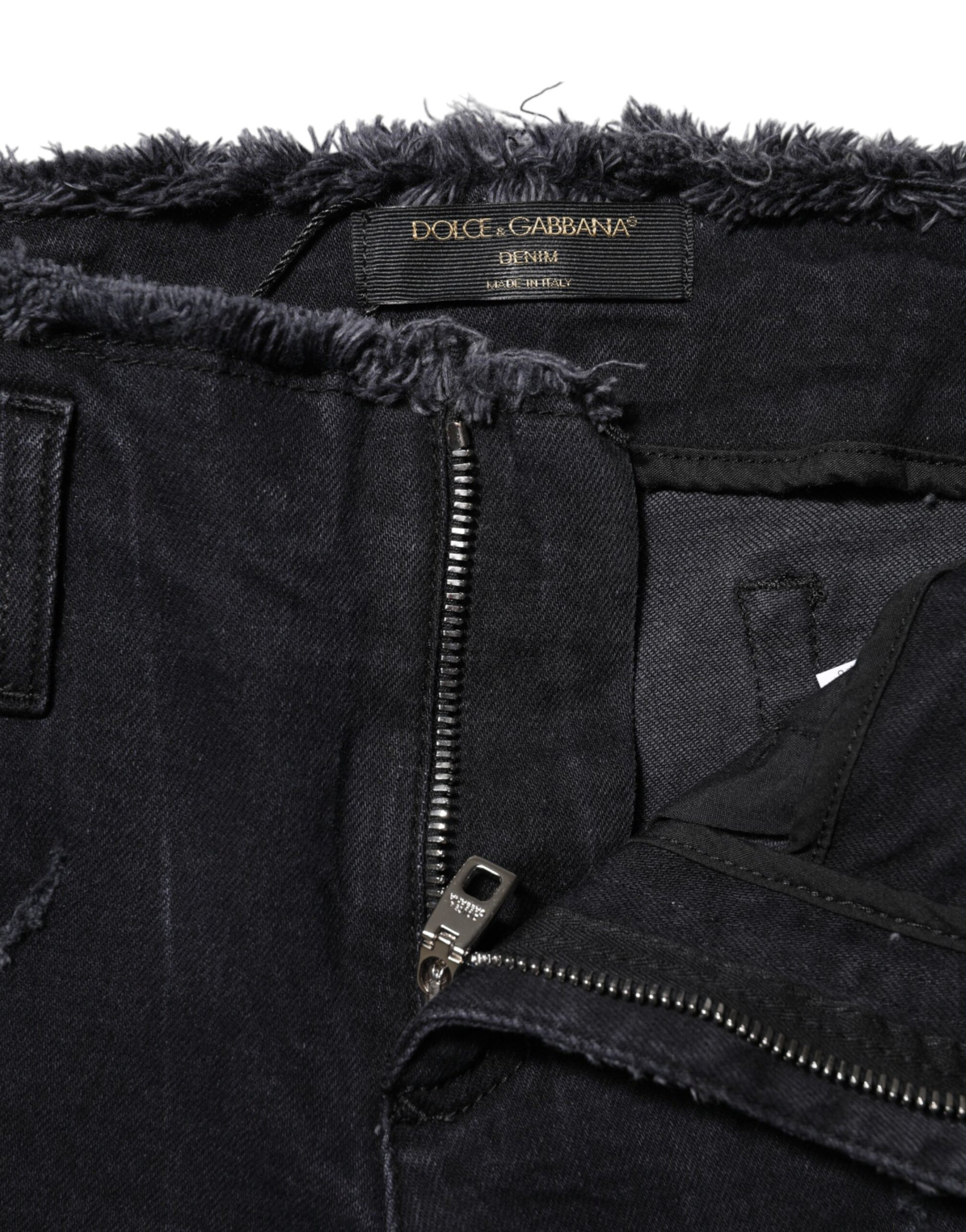 Pair of distressed jeans with zipper detailing