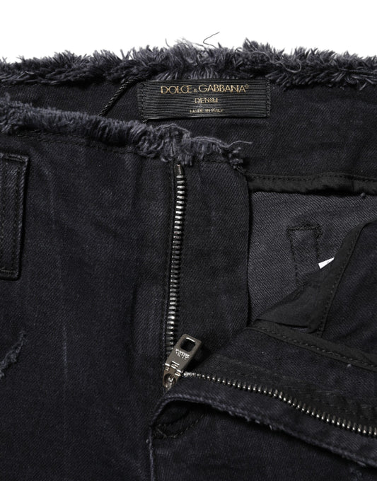 Pair of distressed jeans with zipper detailing
