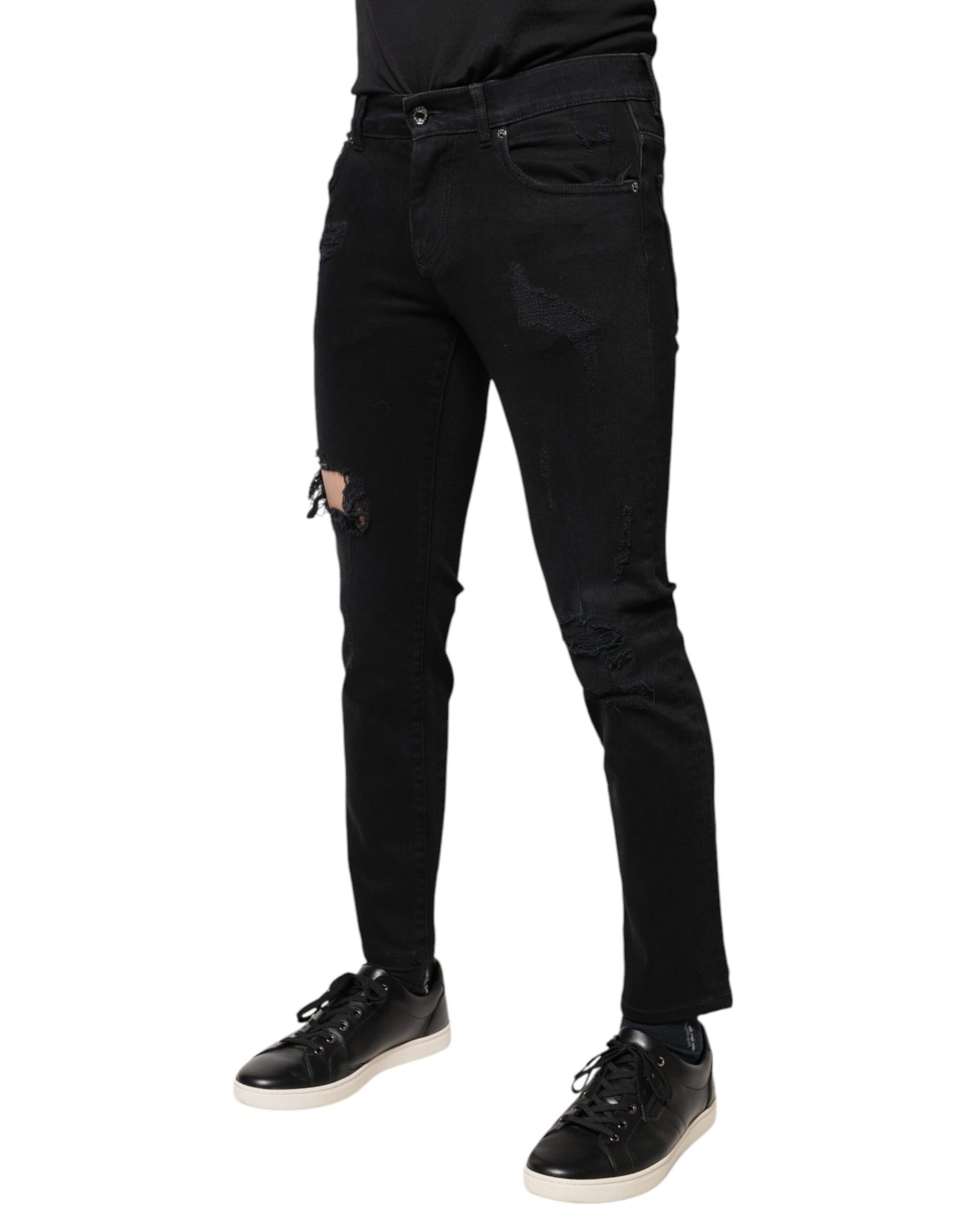 Black skinny jeans with distressed details on legs