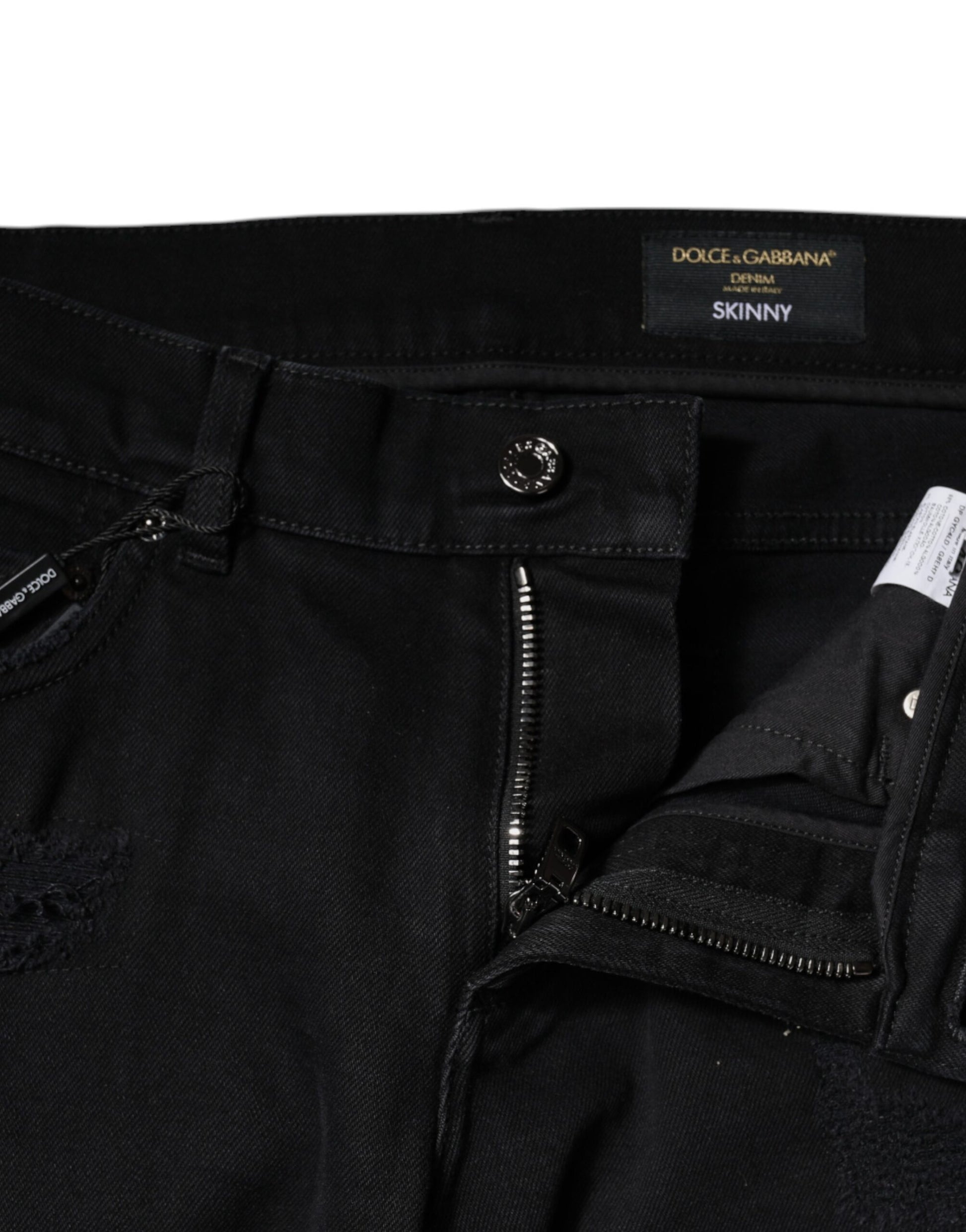 Black skinny jeans with zipper detail on waistband