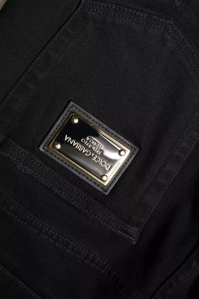 Black jeans with a gold logo on the back pocket