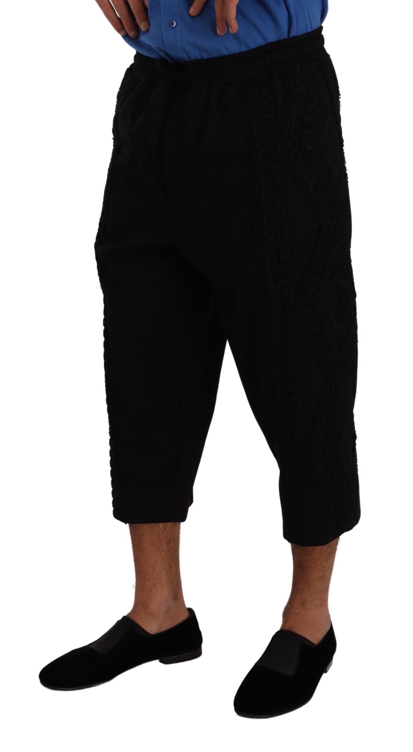 Man wearing black pants and black shoes